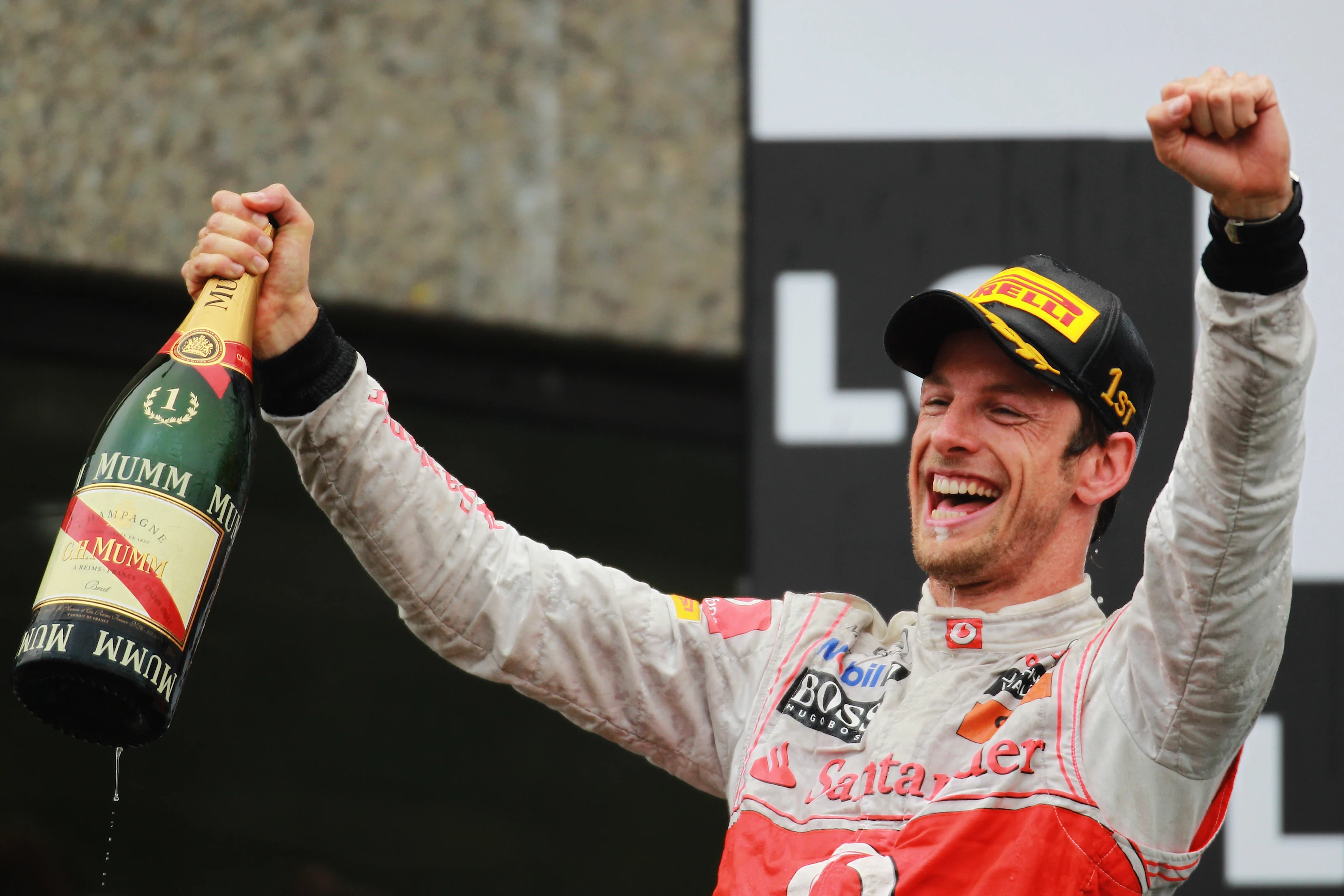 MONTREAL, CANADA - JUNE 12: Jenson Button of Great Britain and McLaren celebrates on the podium