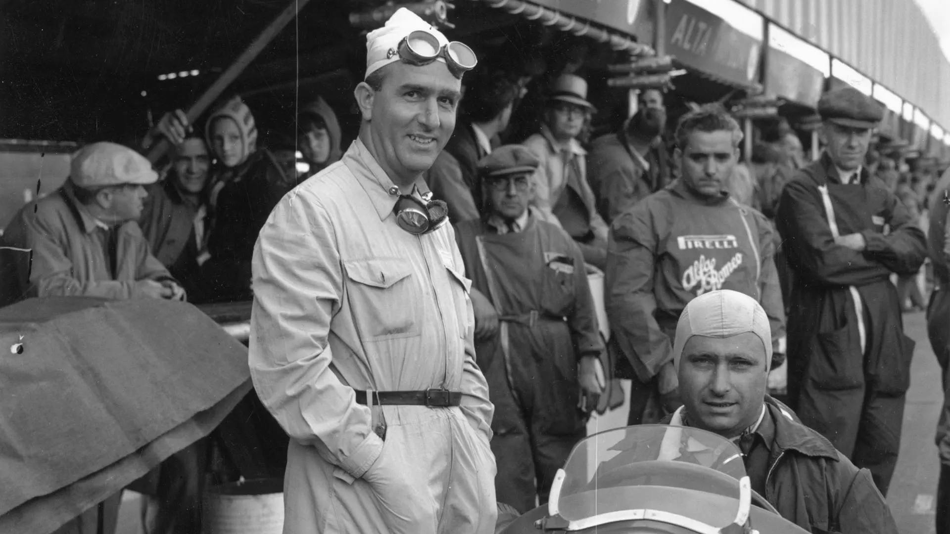 24th August 1950: Racing car drivers Juan Fangio (1911 -1955), left, and Giuseppe Farina, at the
