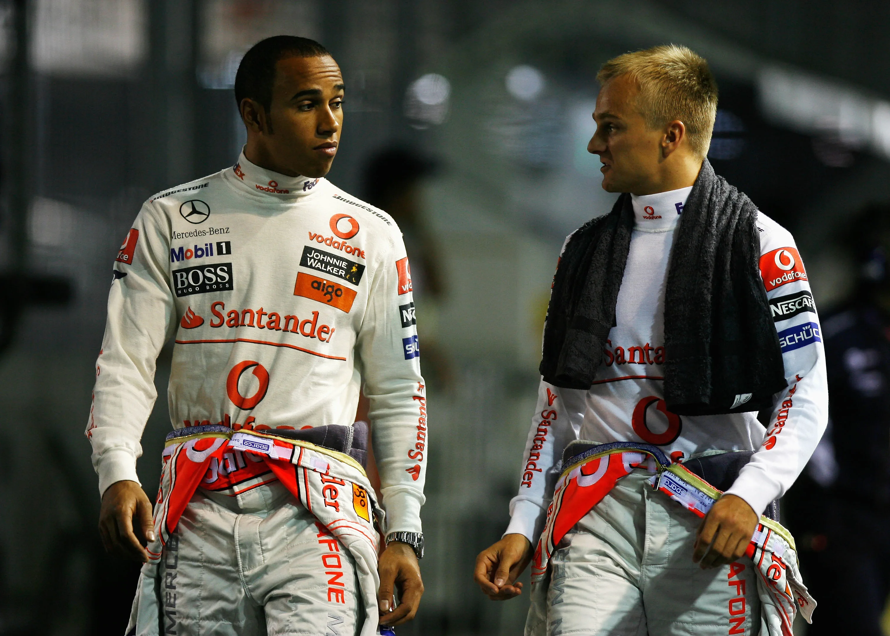 SINGAPORE - SEPTEMBER 27: (L-R) Lewis Hamilton of Great Britain and McLaren Mercedes and Heikki