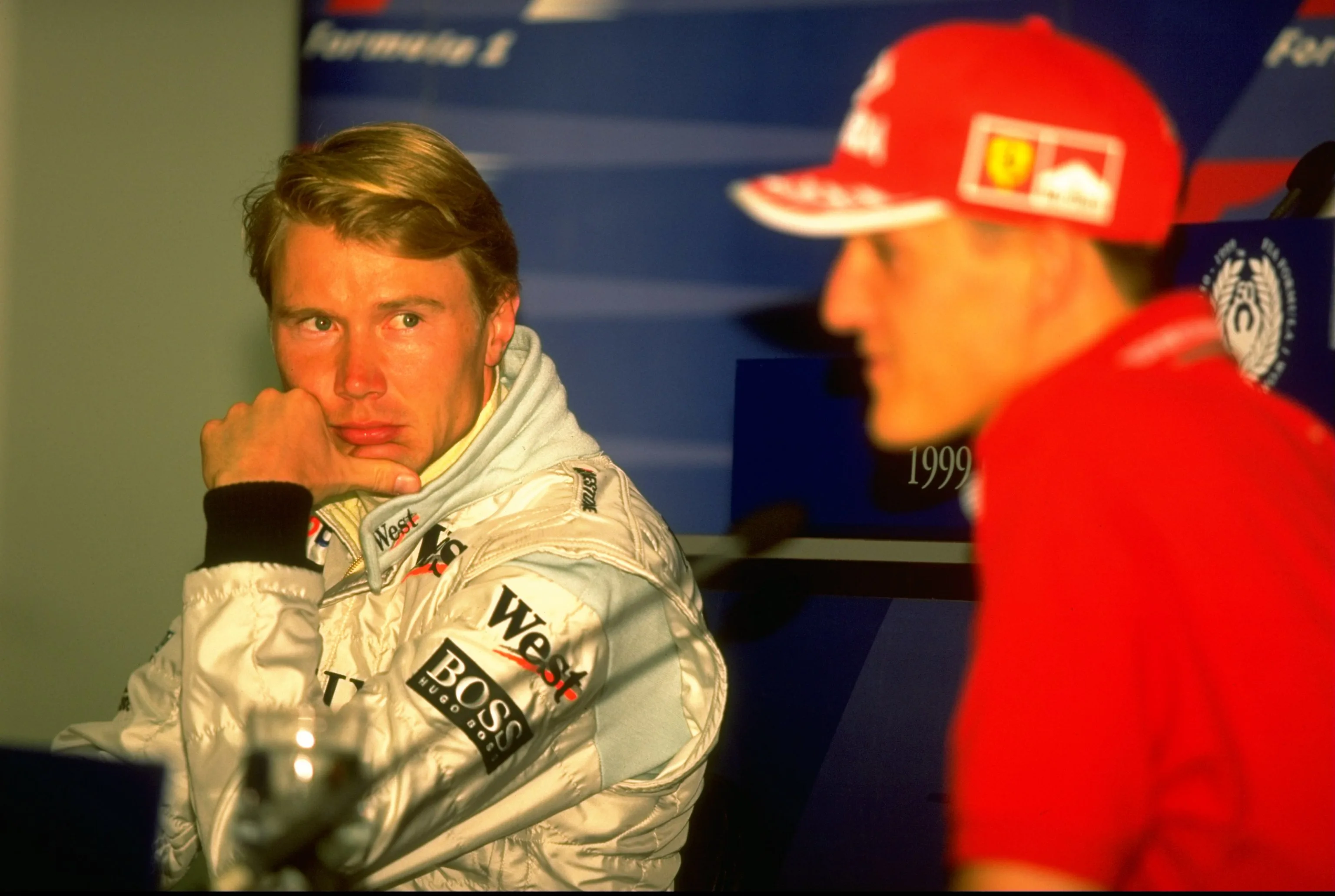 4 Mar 1999: McLaren Mercedes driver Mika Hakkinen eyes up championship rival Michael Schumacher at