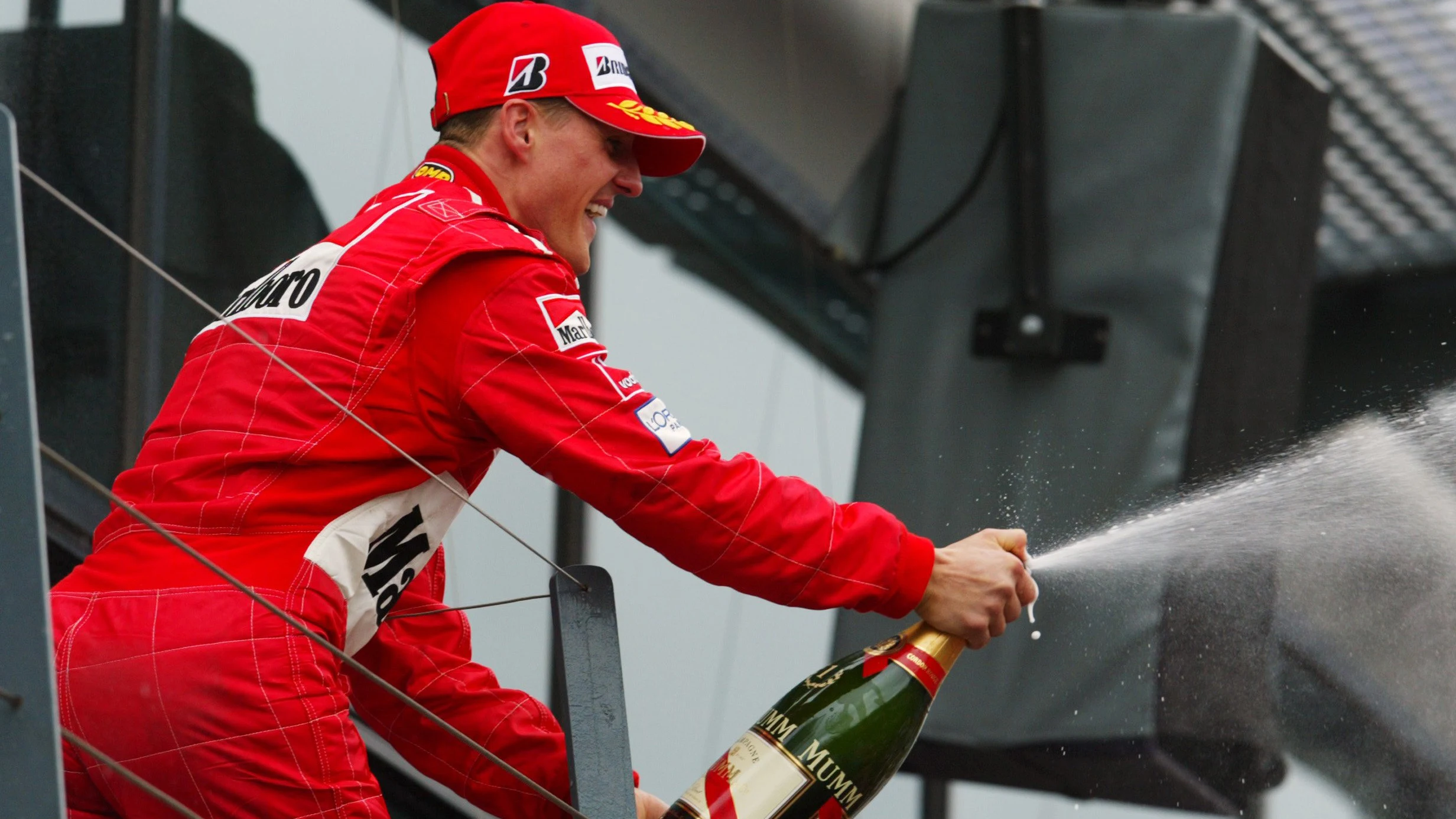Michael Schumacher (GER) Ferrari celebrates his victory on the podium. Australian Grand Prix, Race