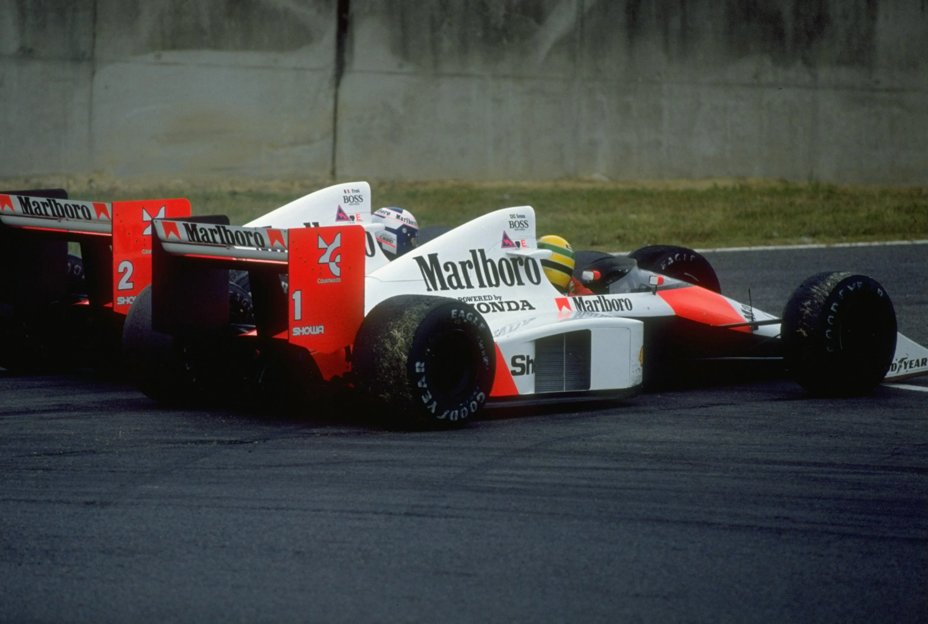 1989: Alain Prost of France and Ayrton Senna of Brazil collide in their McLaren Hondas during the