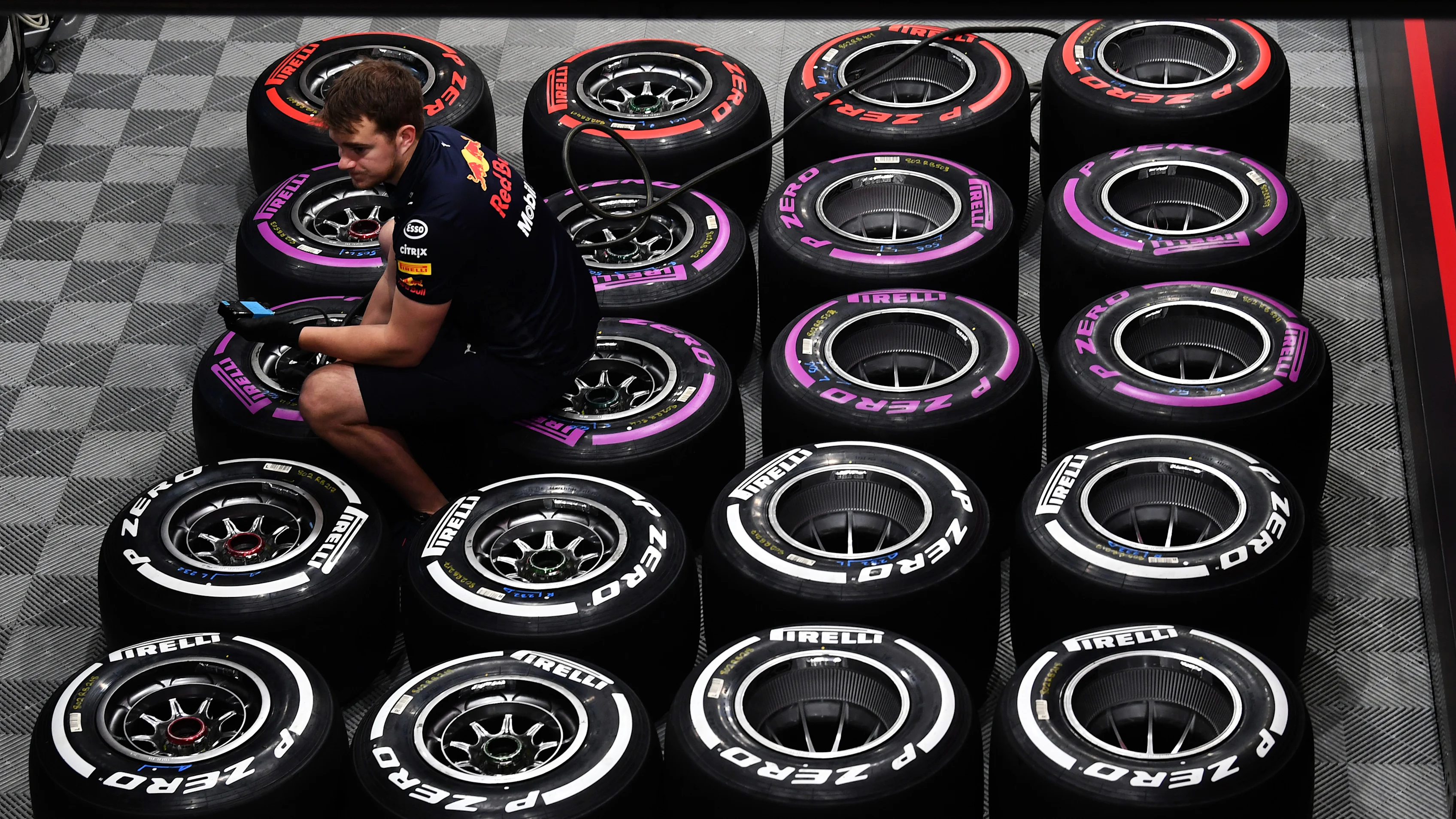 Red Bull Racing mechanic and Pirelli tyres at Formula One Testing, Day Two, Barcelona, Spain, 7