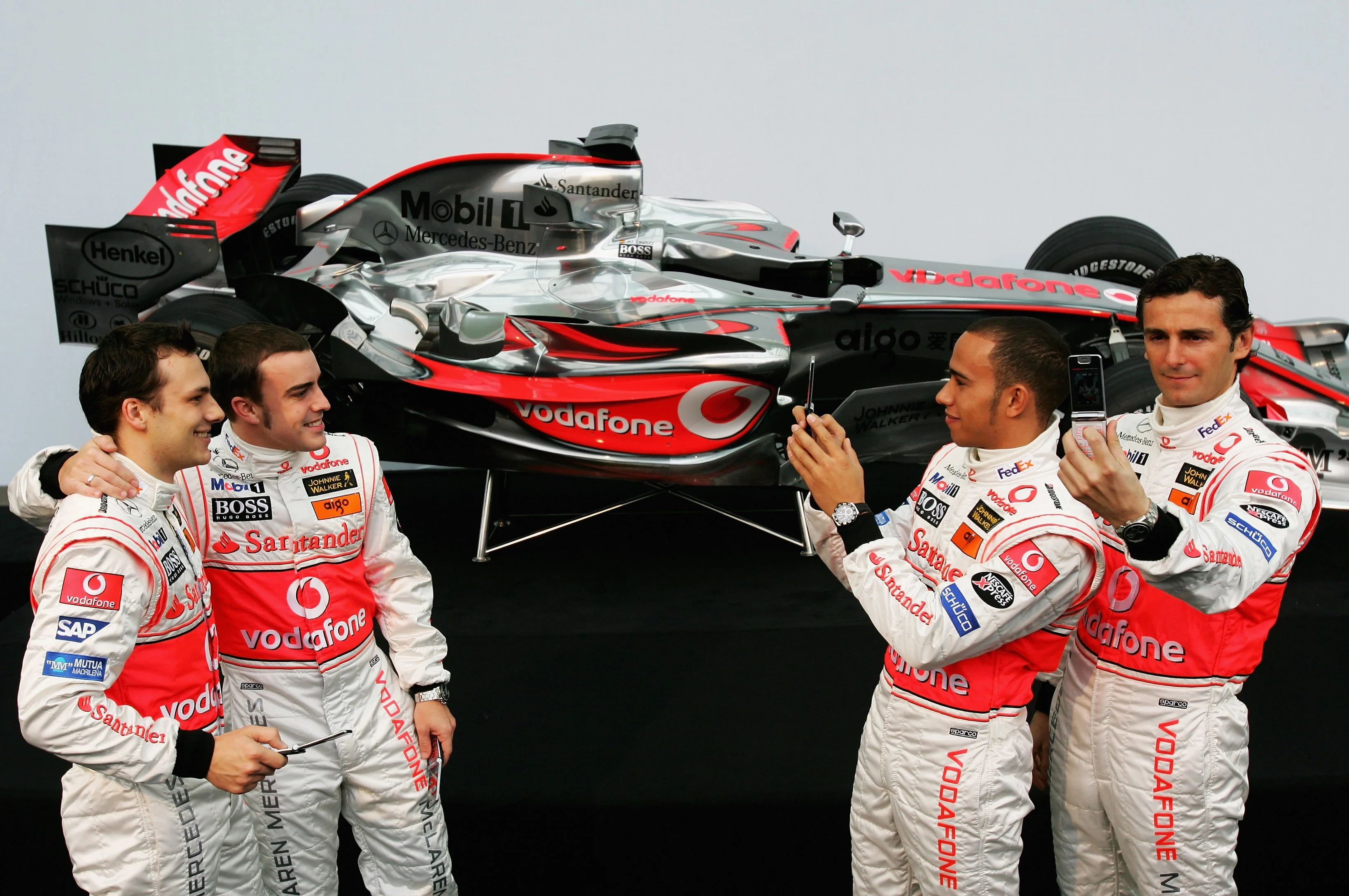 VALENCIA, SPAIN - JANUARY 15: Lewis Hamilton of Great Britain (2nd R) alongside Pedro de la Rosa