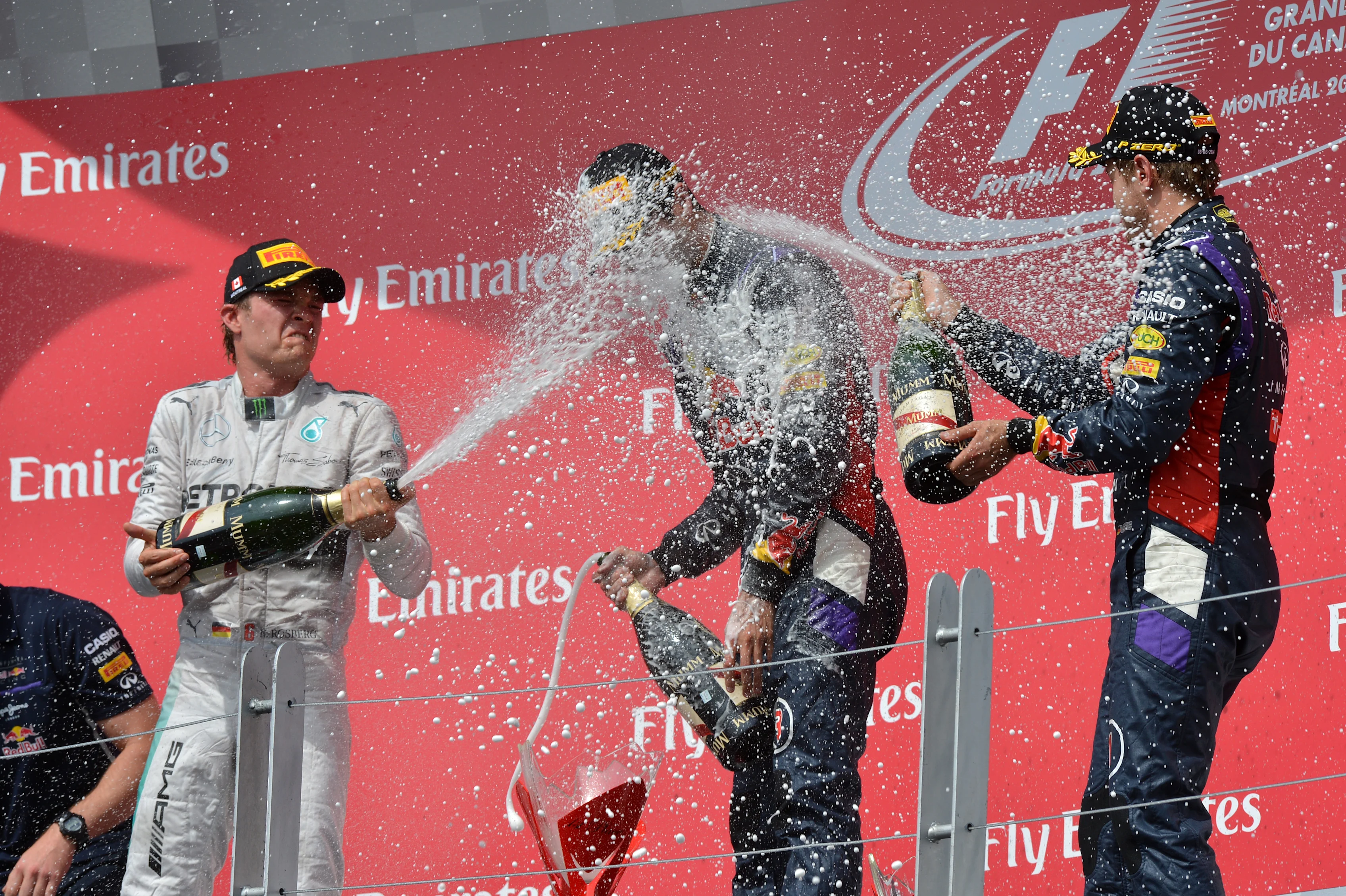 (L to R): Nico Rosberg (GER) Mercedes AMG F1, Daniel Ricciardo (AUS) Red Bull Racing and Sebastian Vettel (GER) Red Bull Racing celebrate on the podium with the champagne.
Formula One World Championship, Rd7, Canadian Grand Prix, Race Day, Montreal, Canada, Sunday 8 June 2014.
