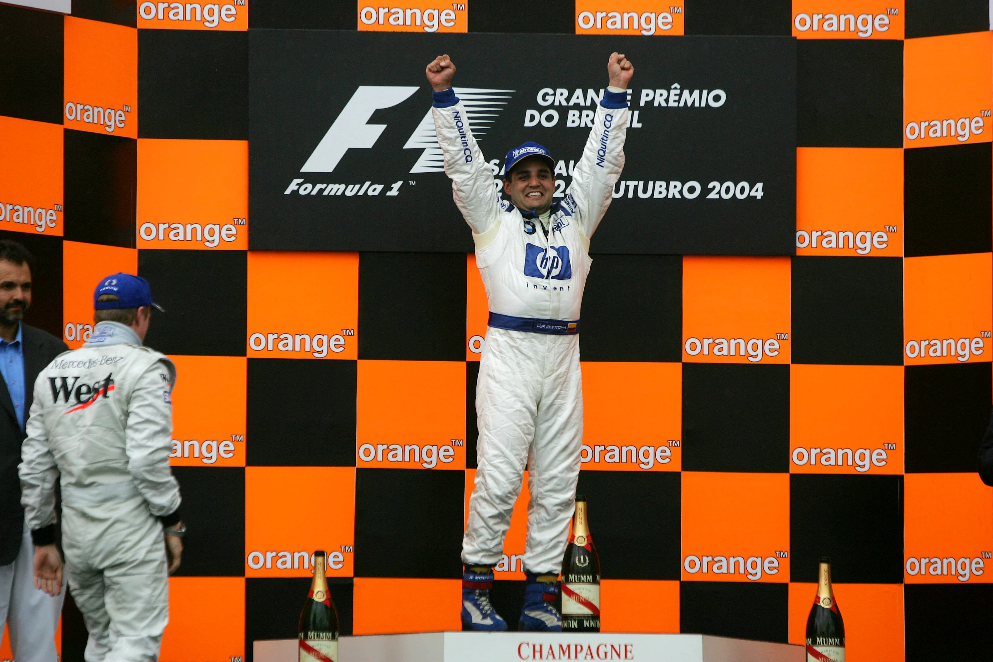 Juan Pablo Montoya (COL) Williams on the podium. Formula One World Championship, Rd18, Brazilian Grand Prix, Race Day, Interlagos, Brazil, 24 October 2004 