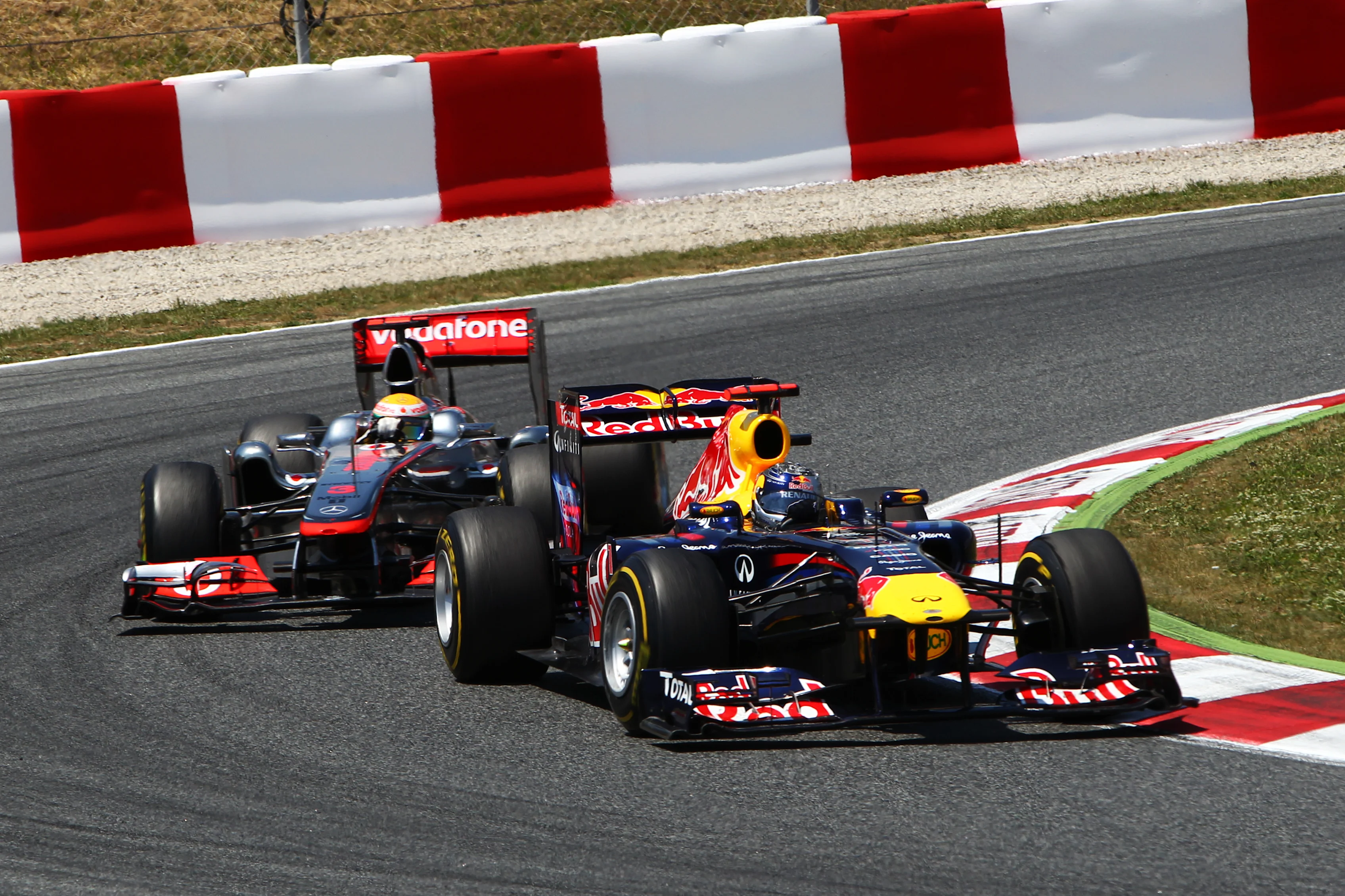 Sebastian Vettel (GER) Red Bull Racing RB7 and Lewis Hamilton (GBR) McLaren MP4/26. Formula One