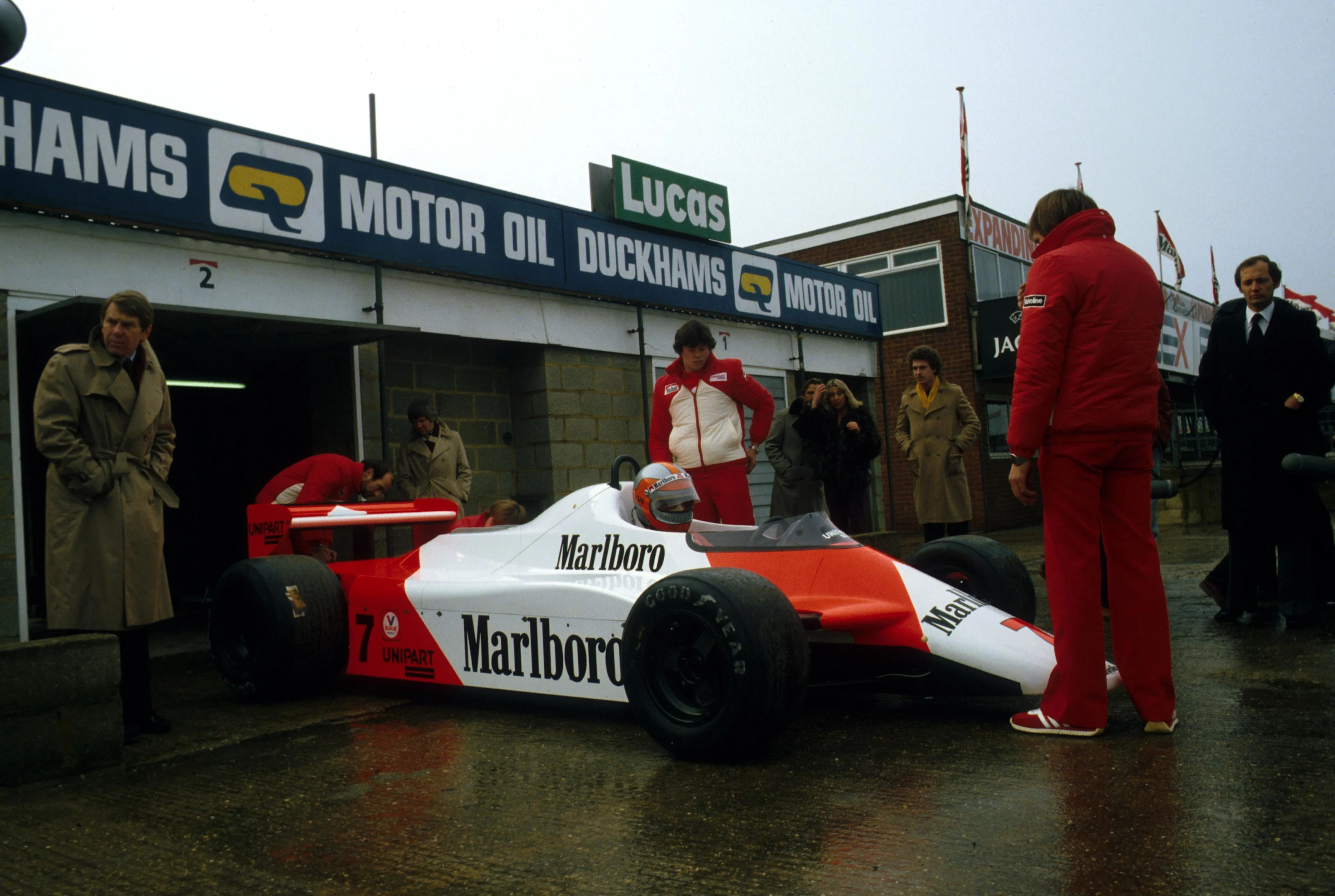 John Watson (GBR) brings the McLaren MP4/1 out of the Silverstone pit garage for its first test.