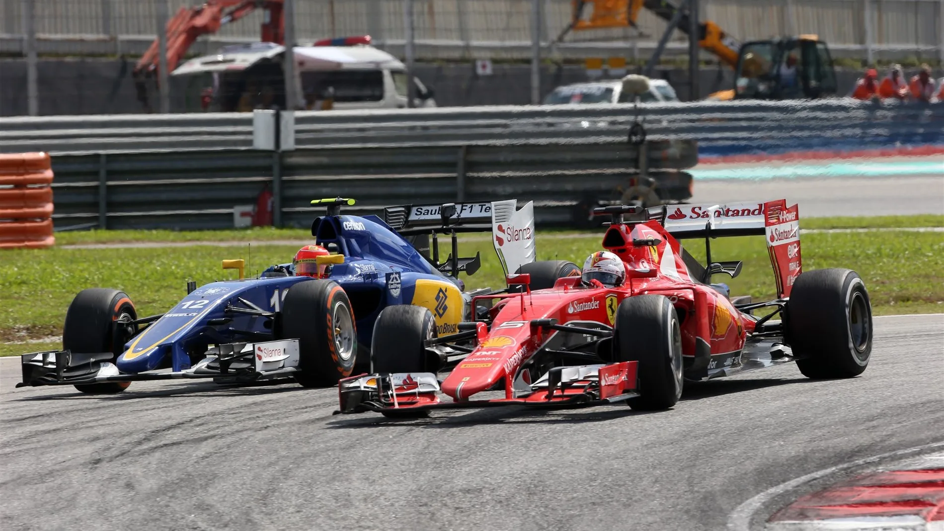 Sebastian Vettel (GER) Ferrari SF15-T and Felipe Nasr (BRA) Sauber C34 battle at Formula One World