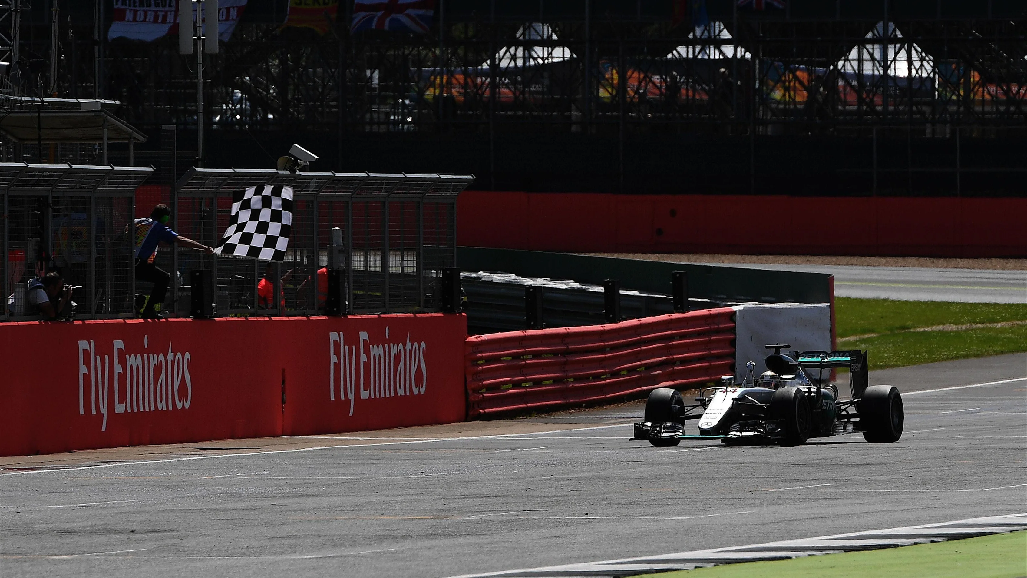 Race winner Lewis Hamilton (GBR) Mercedes-Benz F1 W07 Hybrid takes the chequered flag at Formula One World Championship, Rd10, British Grand Prix, Race, Silverstone, England, Sunday 10 July 2016. © Sutton Images