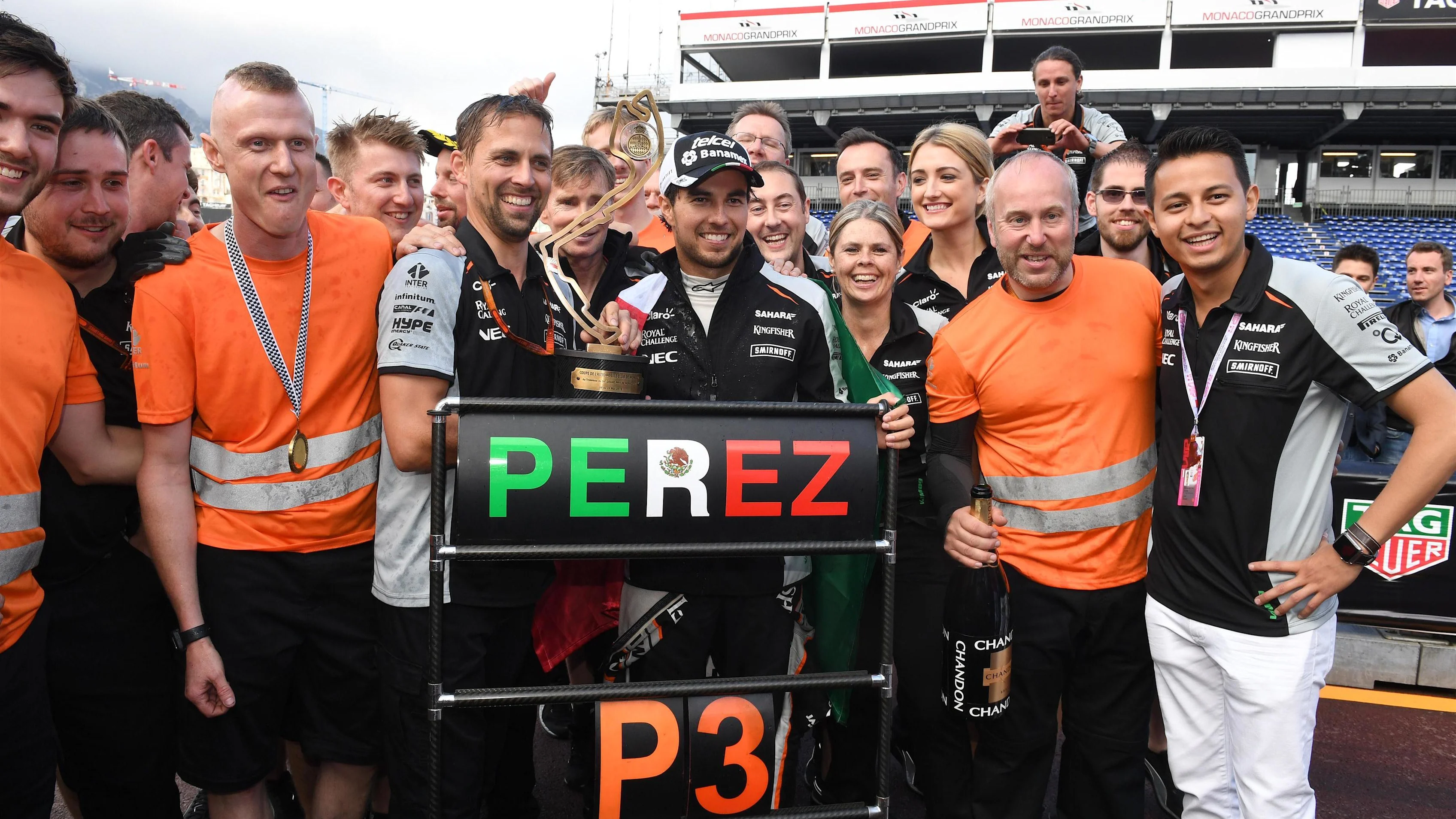 Sergio Perez (MEX) Force India celebrates third place with the team at Formula One World