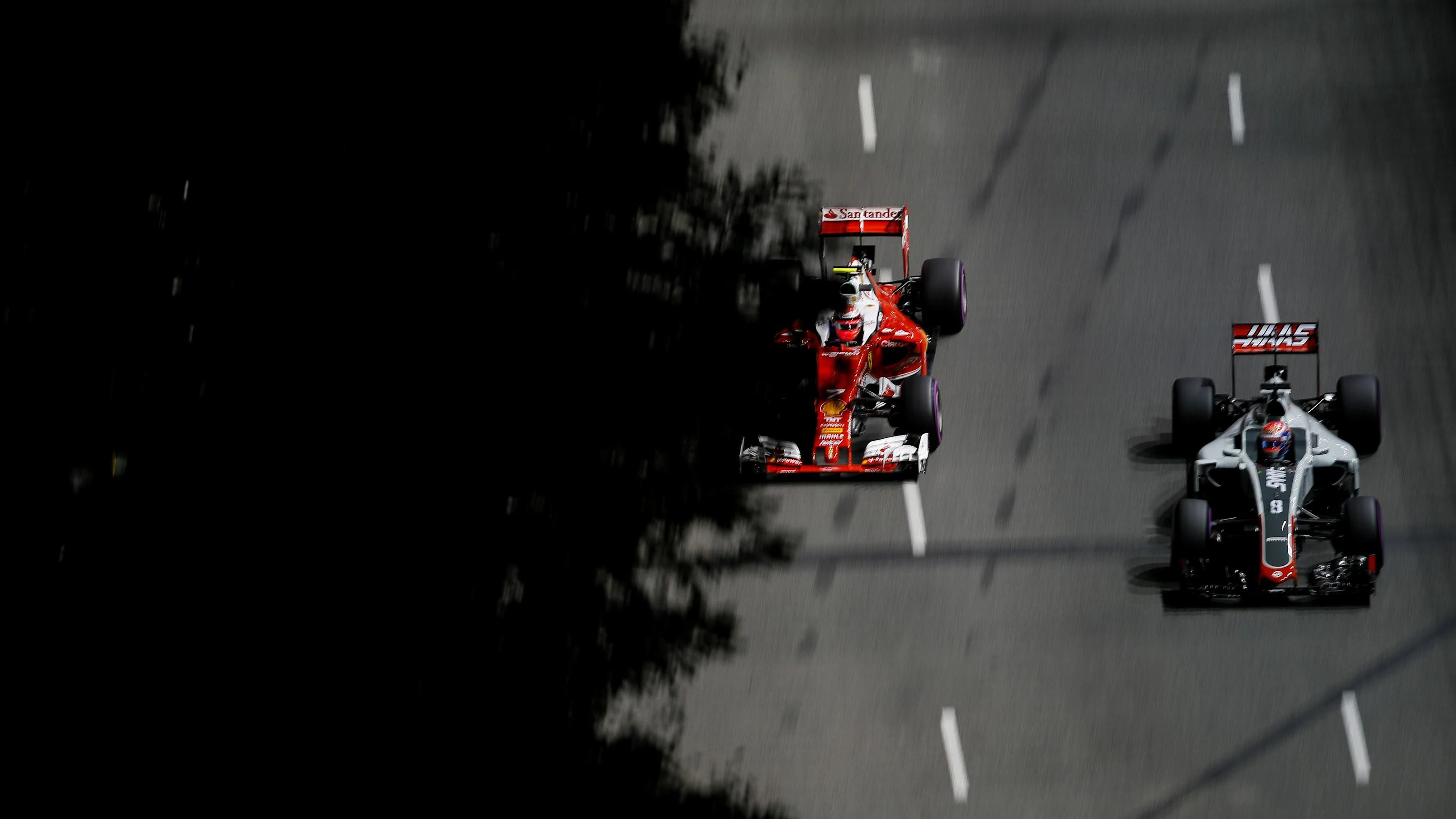 Kimi Raikkonen (FIN) Ferrari SF16-H and Romain Grosjean (FRA) Haas VF-16 at Formula One World Championship, Rd15, Singapore Grand Prix, Practice, Marina Bay Street Circuit, Singapore, Friday 16 September 2016. © Sutton Images