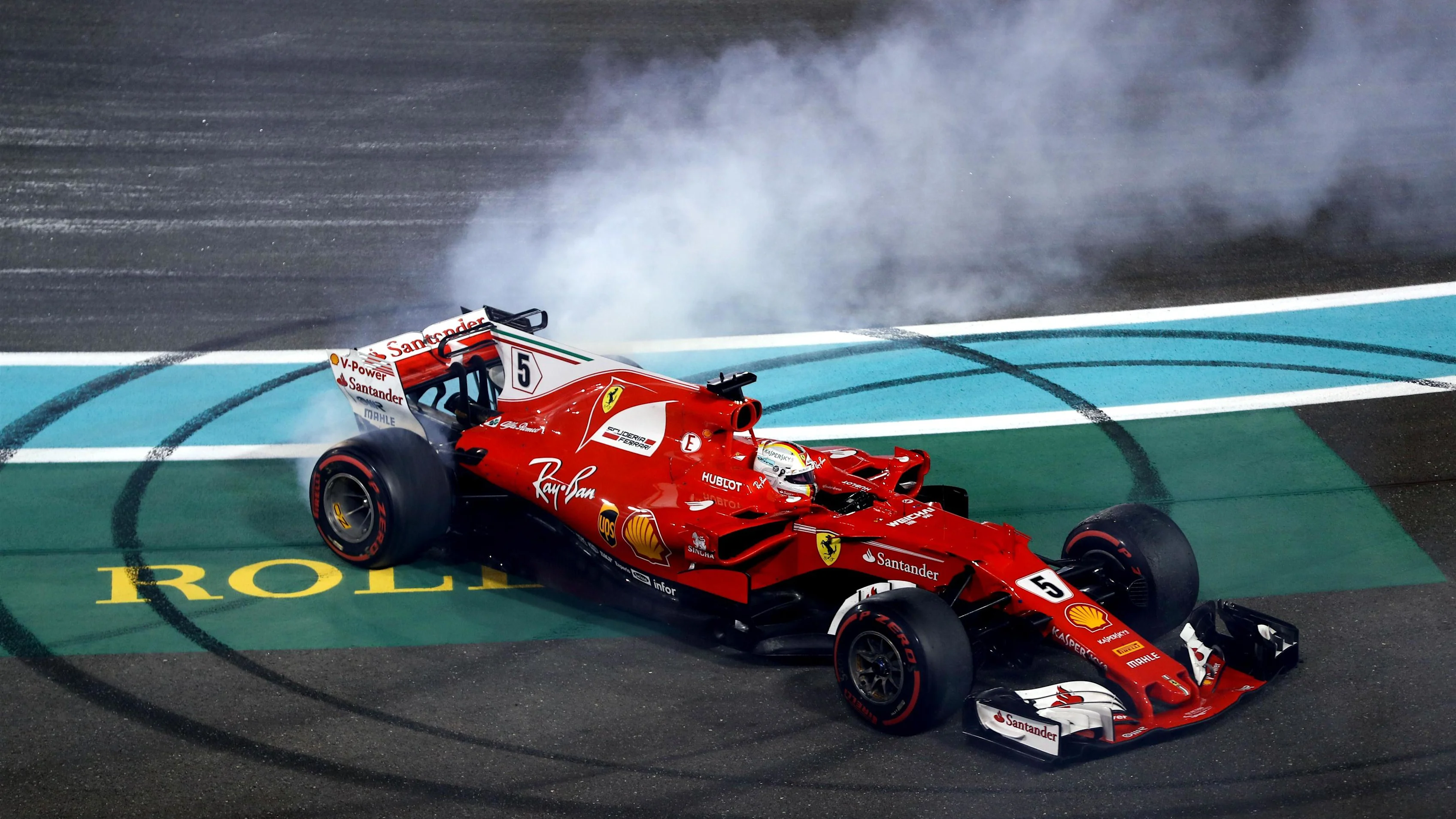 Sebastian Vettel (GER) Ferrari SF70-H celebrates and performs donuts in parc ferme at Formula One World Championship, Rd20, Abu Dhabi Grand Prix, Race, Yas Marina Circuit, Abu Dhabi, UAE, Sunday 26 November 2017. © Lionel Ng/Sutton Images