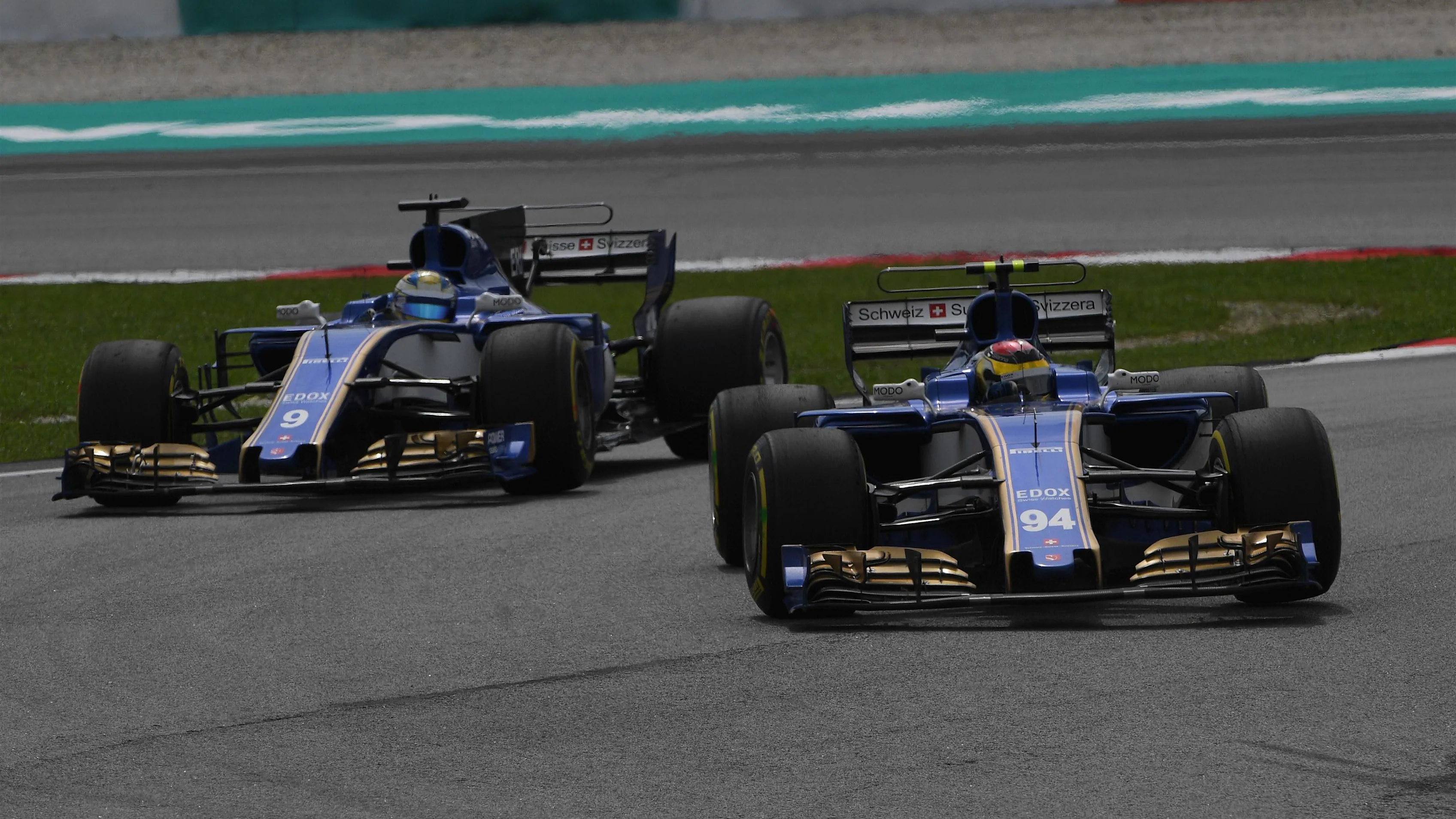 Pascal Wehrlein (GER) Sauber C36 leads Marcus Ericsson (SWE) Sauber C36 at Formula One World