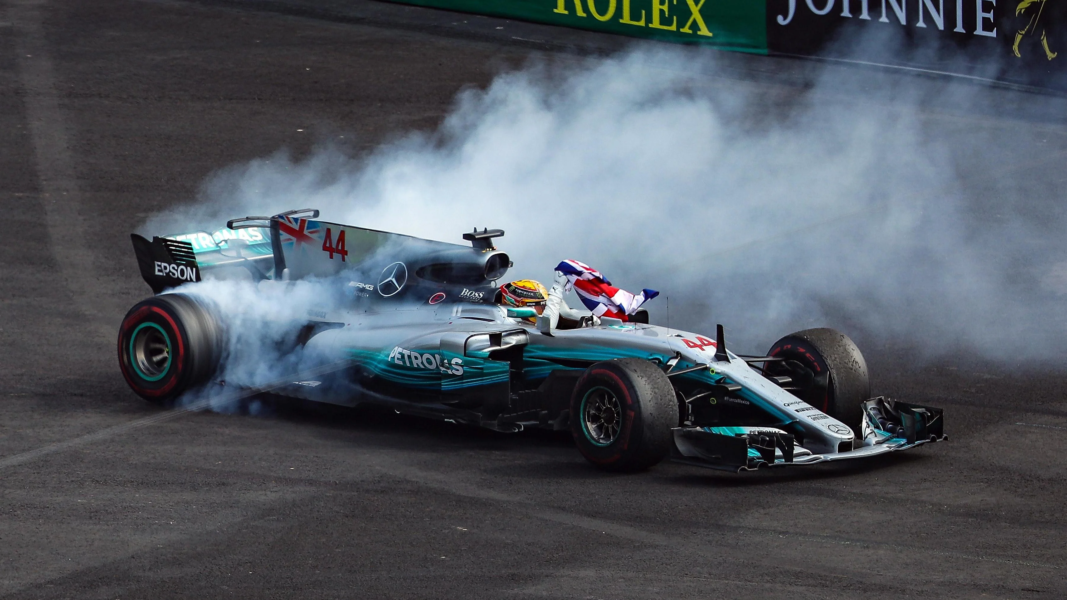 Lewis Hamilton (GBR) Mercedes-Benz F1 W08 Hybrid celebrates in parc ferme with the Union Jack flag