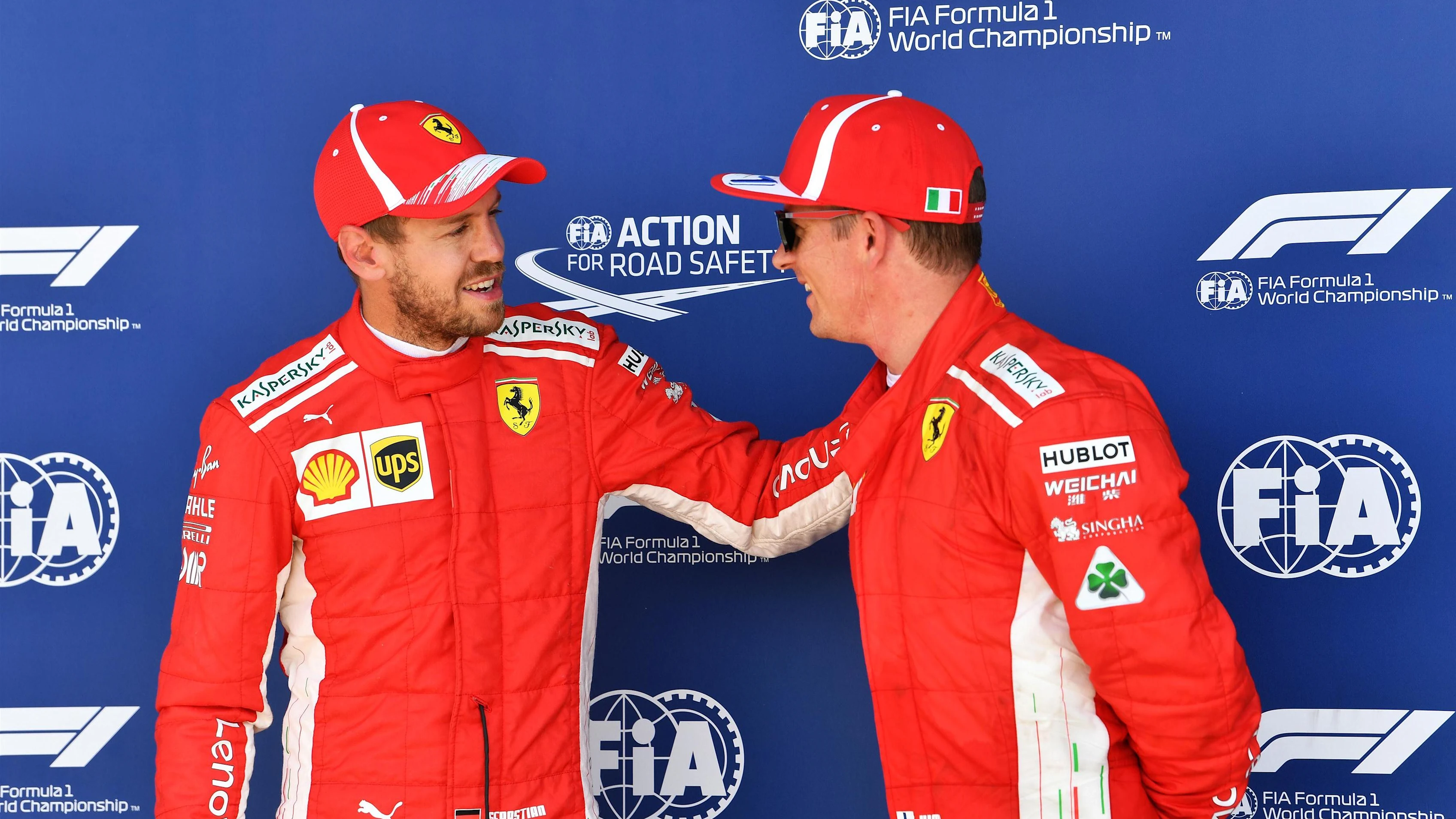 Sebastian Vettel (GER) Ferrari and Kimi Raikkonen (FIN) Ferrari celebrate in parc ferme at Formula One World Championship, Rd10, British Grand Prix, Qualifying, Silverstone, England, Saturday 7 July 2018. © Mark Sutton/Sutton Images