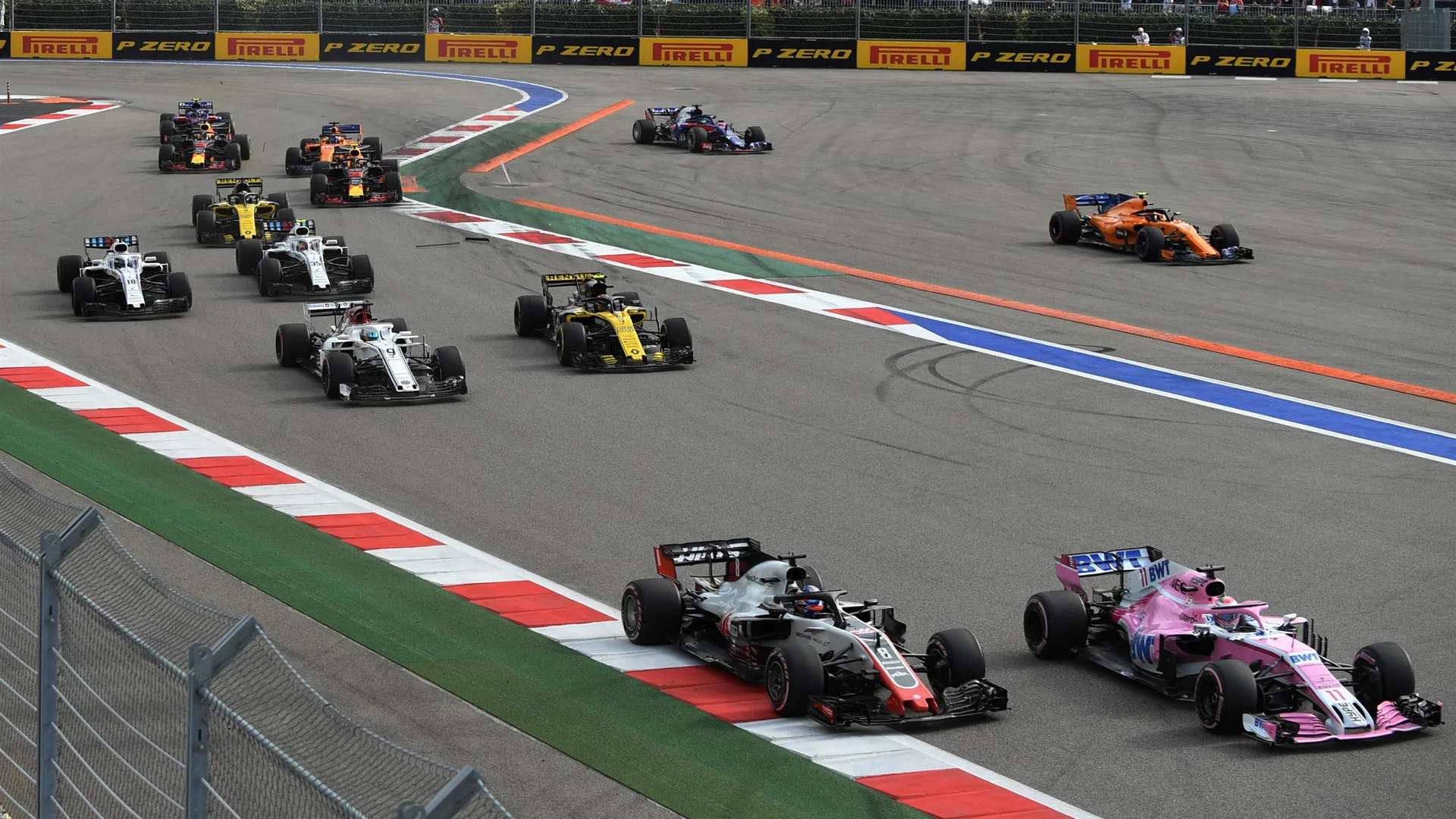 Sergio Perez, Racing Point Force India VJM11 and Romain Grosjean, Haas F1 Team VF-18 at Formula One