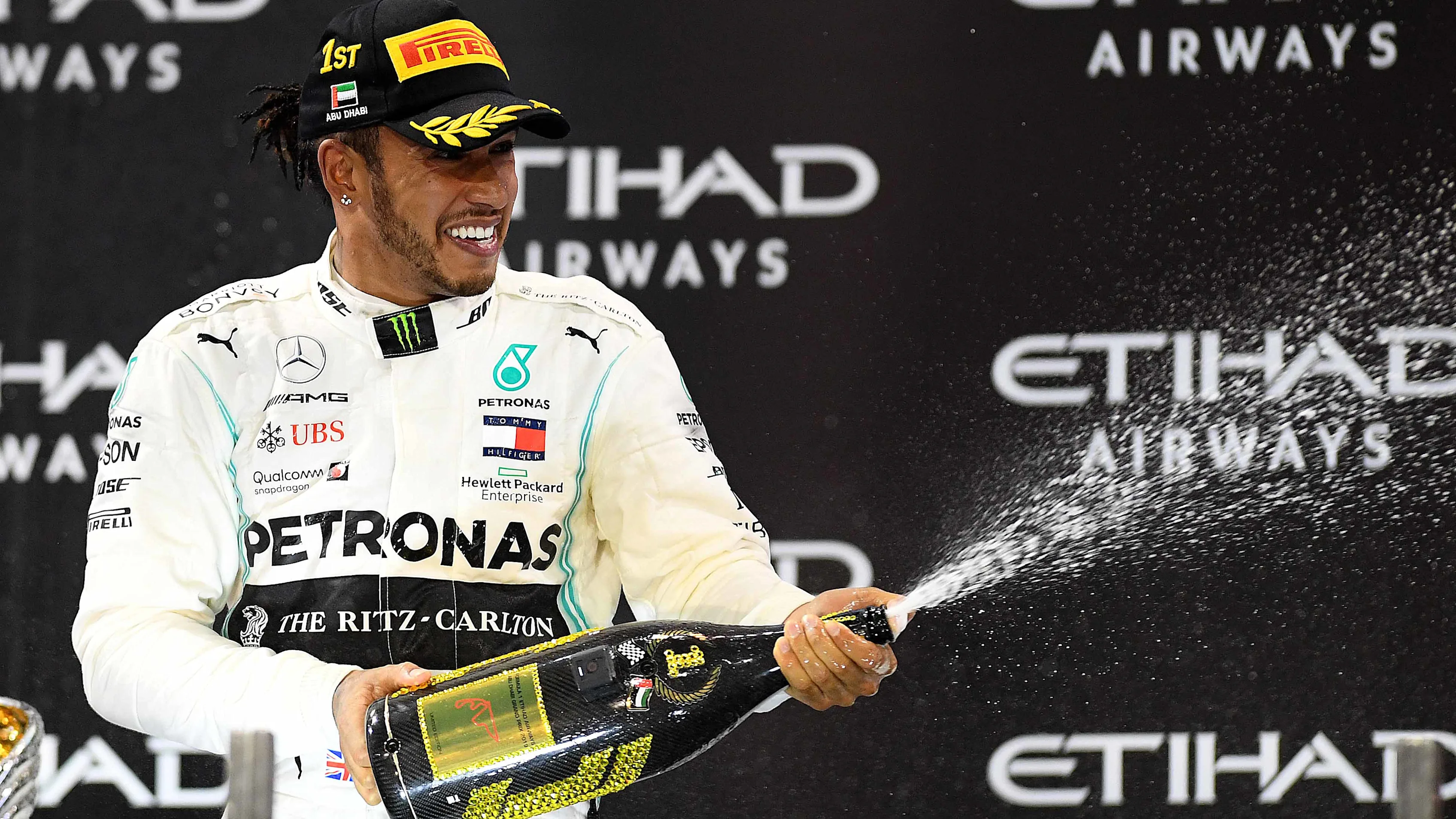 ABU DHABI, UNITED ARAB EMIRATES - DECEMBER 01: Race winner Lewis Hamilton of Great Britain and
