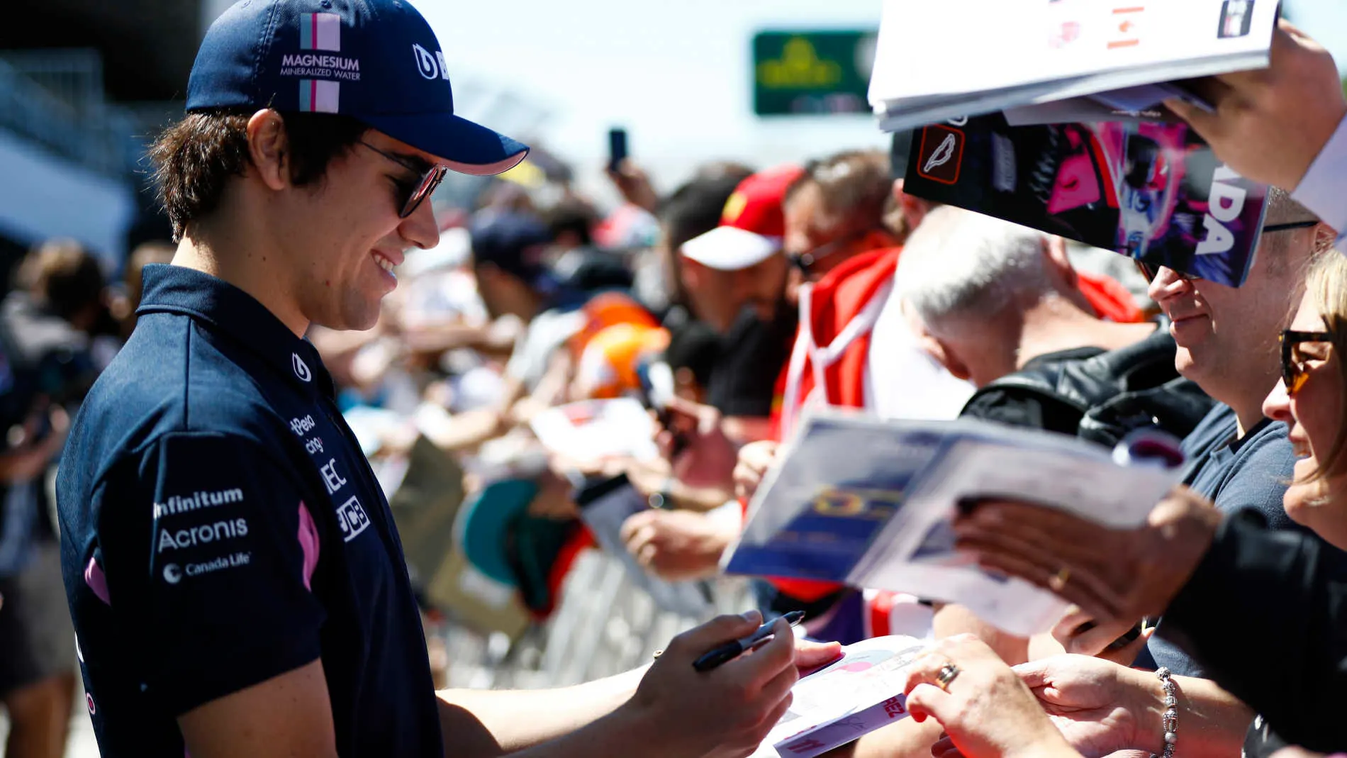 CIRCUIT GILLES-VILLENEUVE, CANADA - JUNE 06: Lance Stroll, Racing Point, signs autographs during