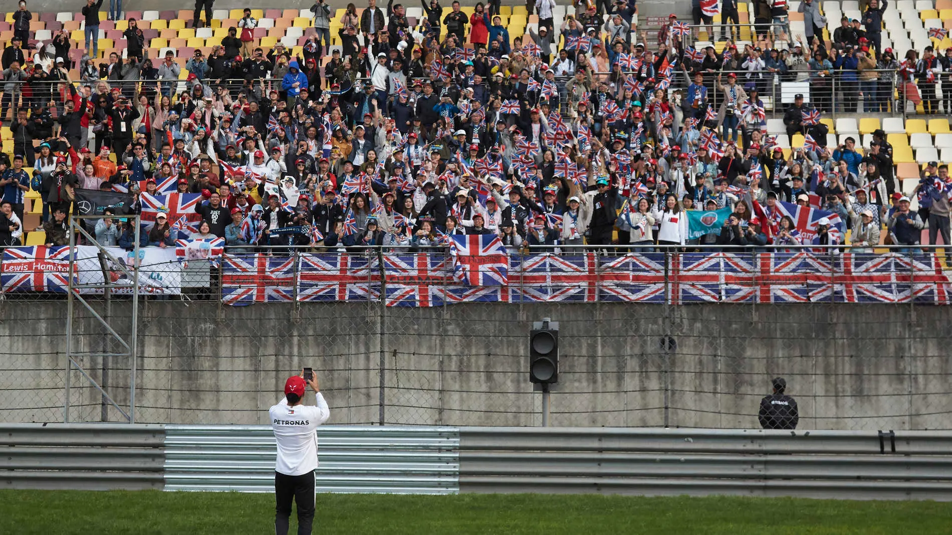SHANGHAI INTERNATIONAL CIRCUIT, CHINA - APRIL 14: Lewis Hamilton, Mercedes AMG F1, takes a photo of