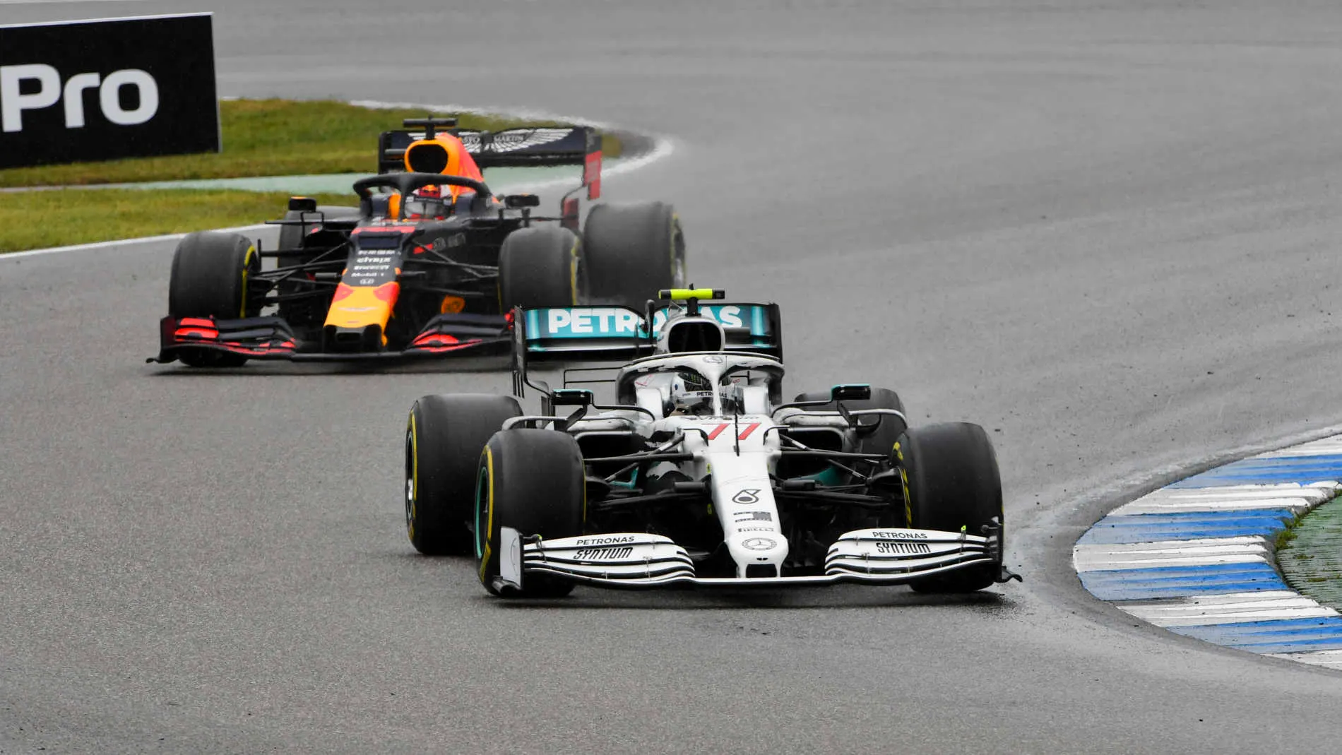 HOCKENHEIMRING, GERMANY - JULY 28: Valtteri Bottas, Mercedes AMG W10, leads Max Verstappen, Red