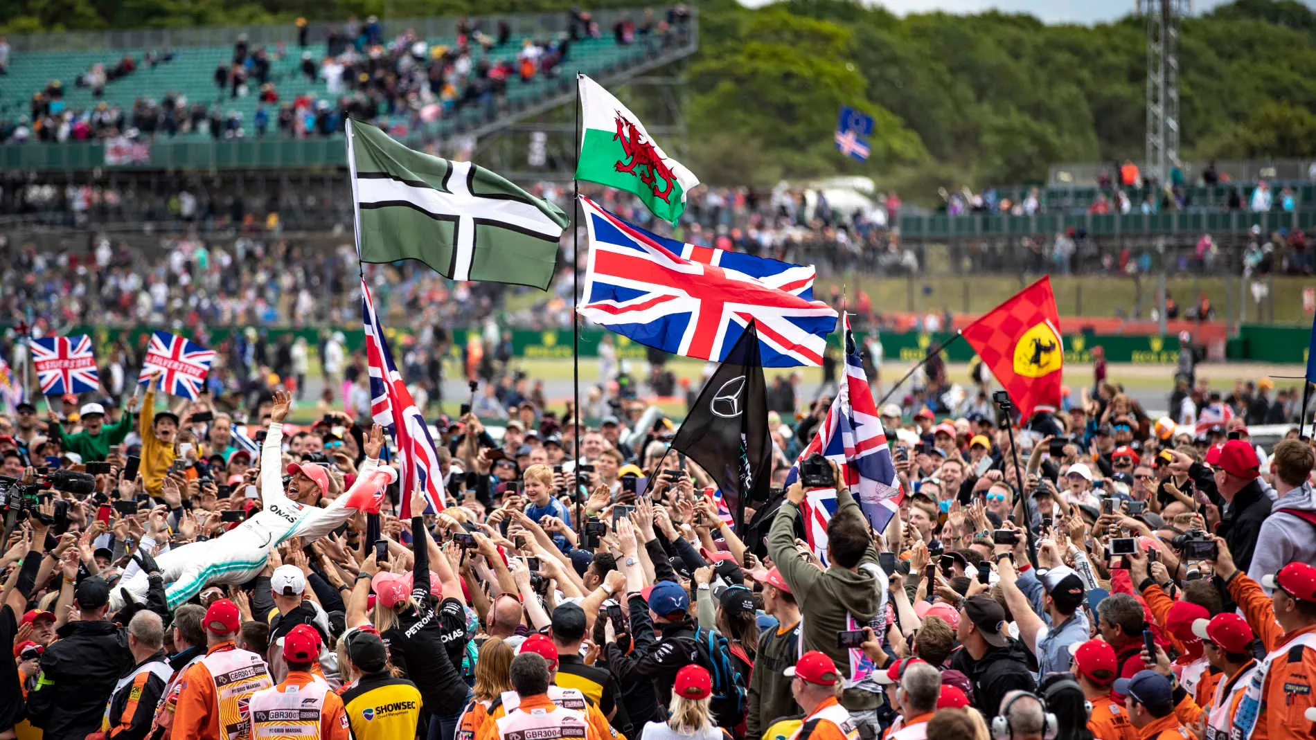 SILVERSTONE, UNITED KINGDOM - JULY 14: Lewis Hamilton, Mercedes AMG F1, 1st position, celebrates with his fans during the British GP at Silverstone on July 14, 2019 in Silverstone, United Kingdom. (Photo by Glenn Dunbar / LAT Images)