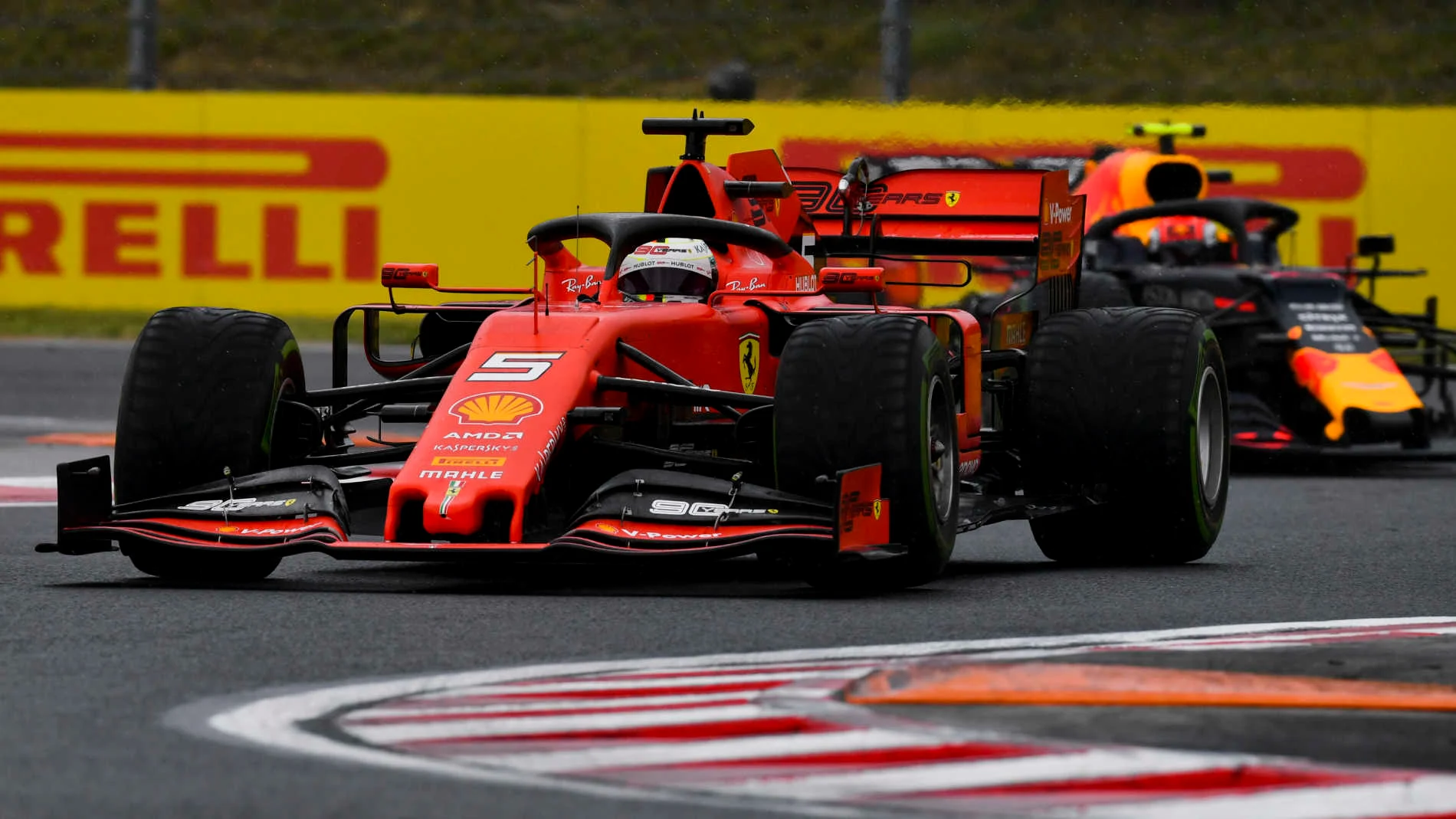 HUNGARORING, HUNGARY - AUGUST 02: Sebastian Vettel, Ferrari SF90, leads Pierre Gasly, Red Bull