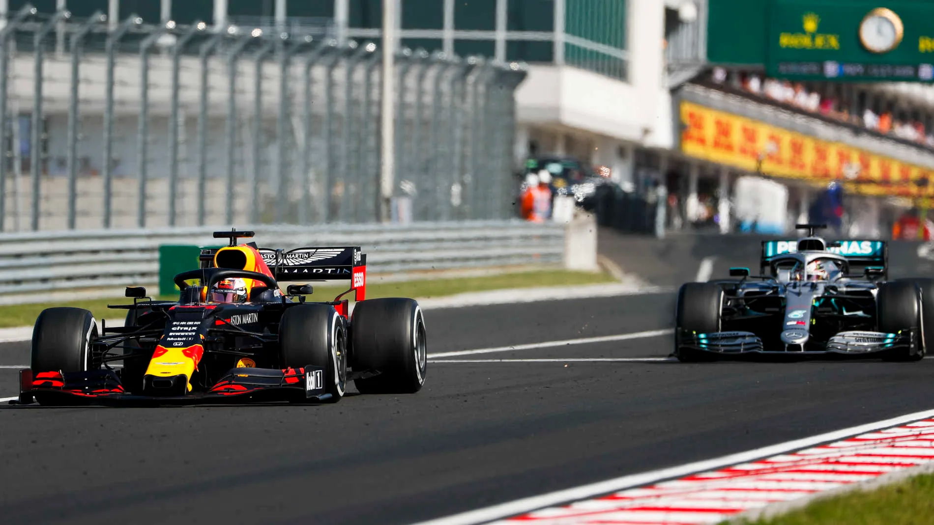 HUNGARORING, HUNGARY - AUGUST 04: Max Verstappen, Red Bull Racing RB15, leads Lewis Hamilton,