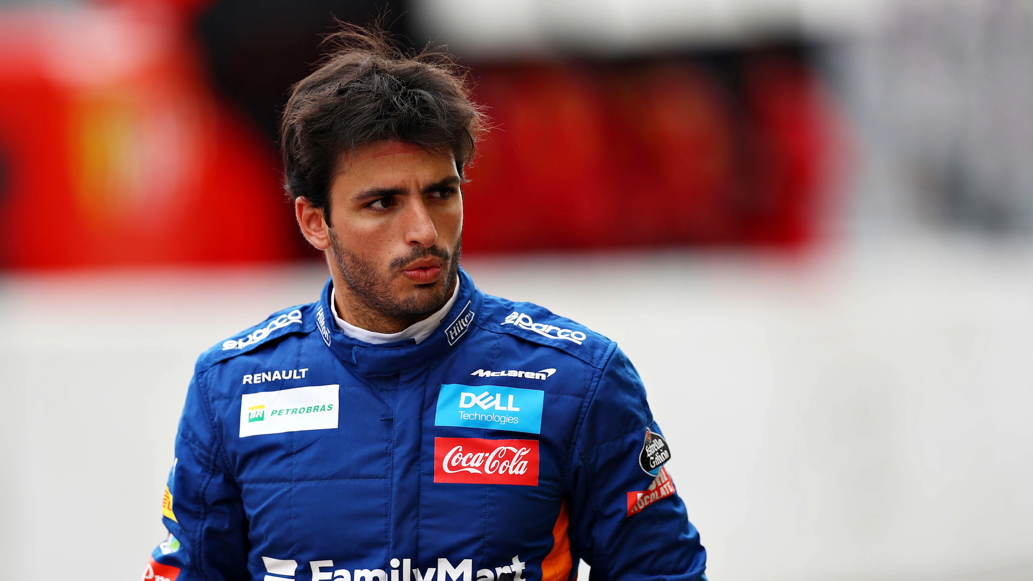 SUZUKA, JAPAN - OCTOBER 11: Carlos Sainz of Spain and McLaren F1 walks in the Pitlane during practice for the F1 Grand Prix of Japan at Suzuka Circuit on October 11, 2019 in Suzuka, Japan. (Photo by Mark Thompson/Getty Images)