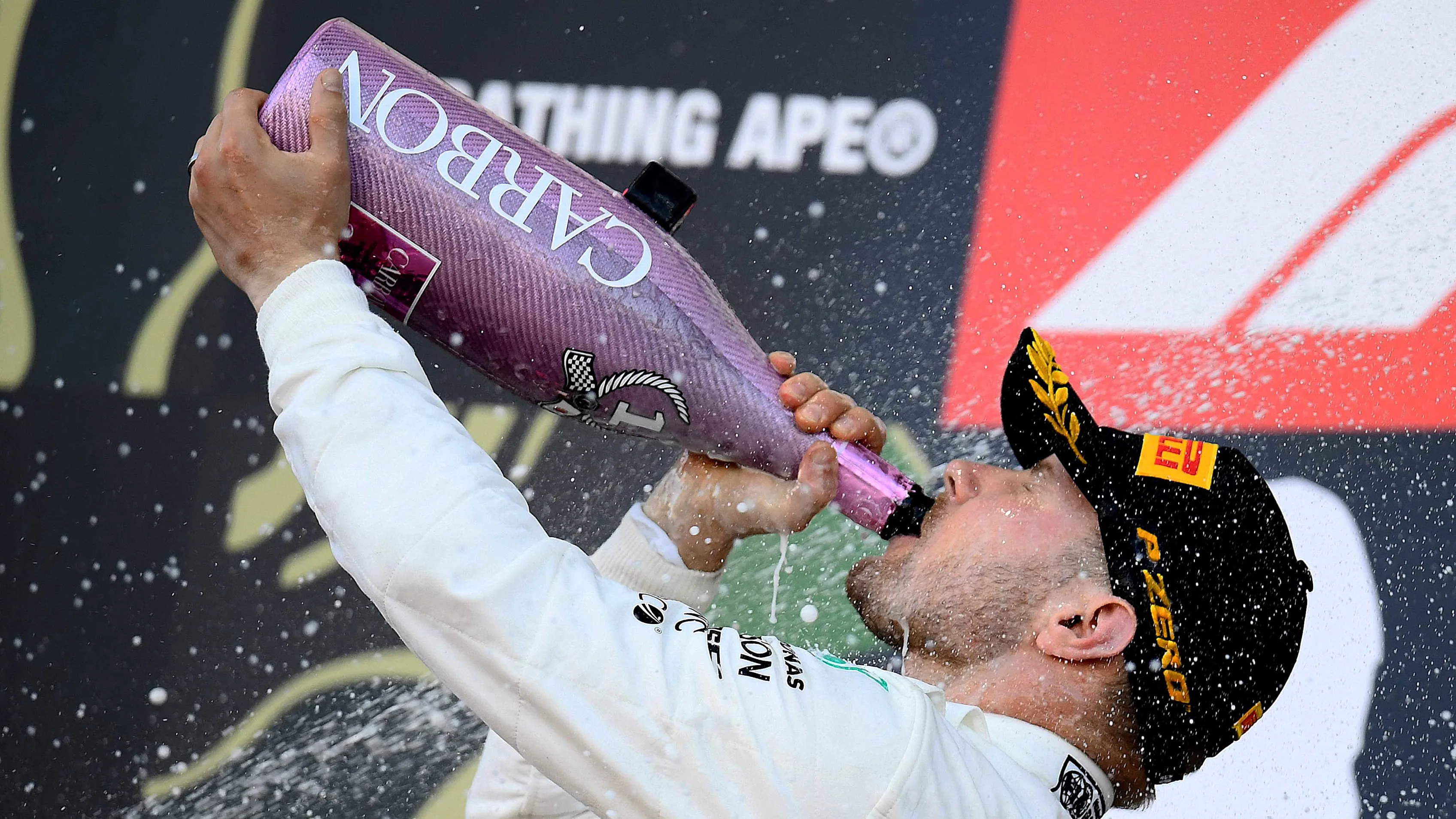 SUZUKA, JAPAN - OCTOBER 13: Race winner Valtteri Bottas of Finland and Mercedes GP celebrates on