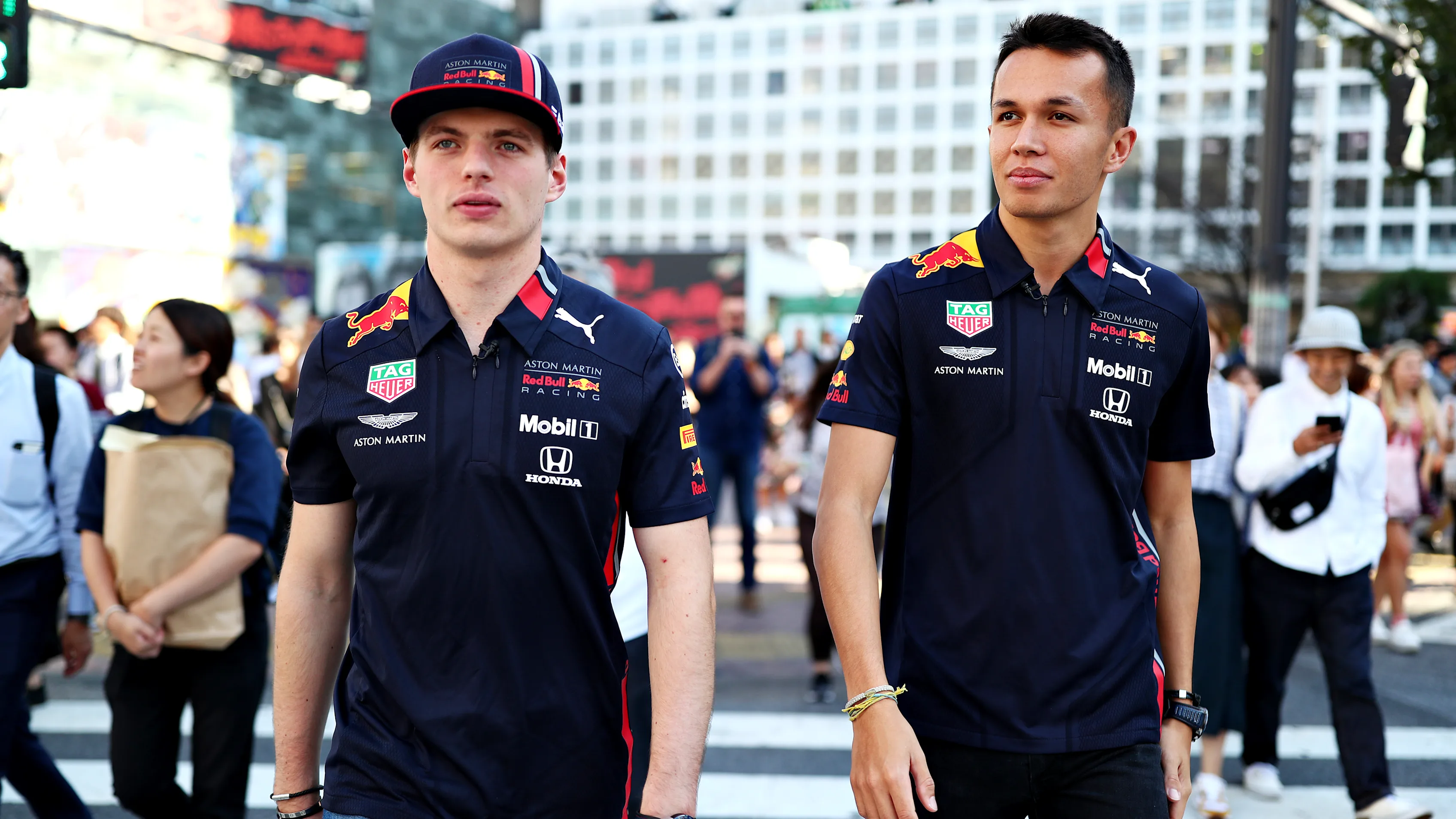TOKYO, JAPAN - OCTOBER 09: Max Verstappen of Netherlands and Red Bull Racing and Alexander Albon of