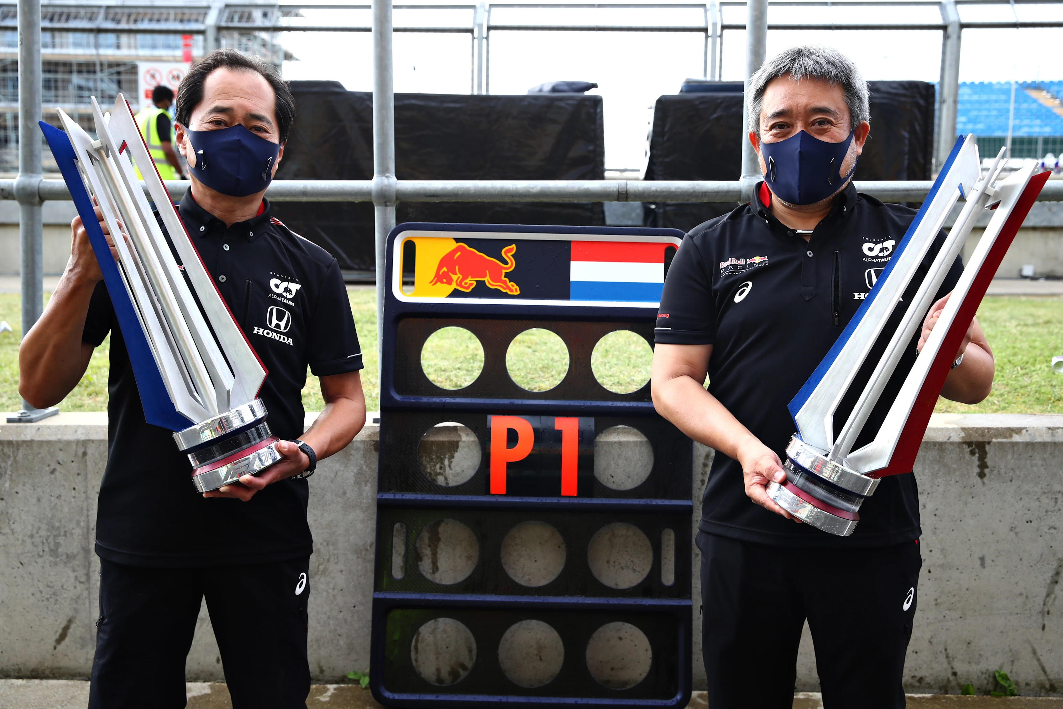 NORTHAMPTON, ENGLAND - AUGUST 09: Toyoharu Tanabe of Honda and Masashi Yamamoto of Honda celebrate