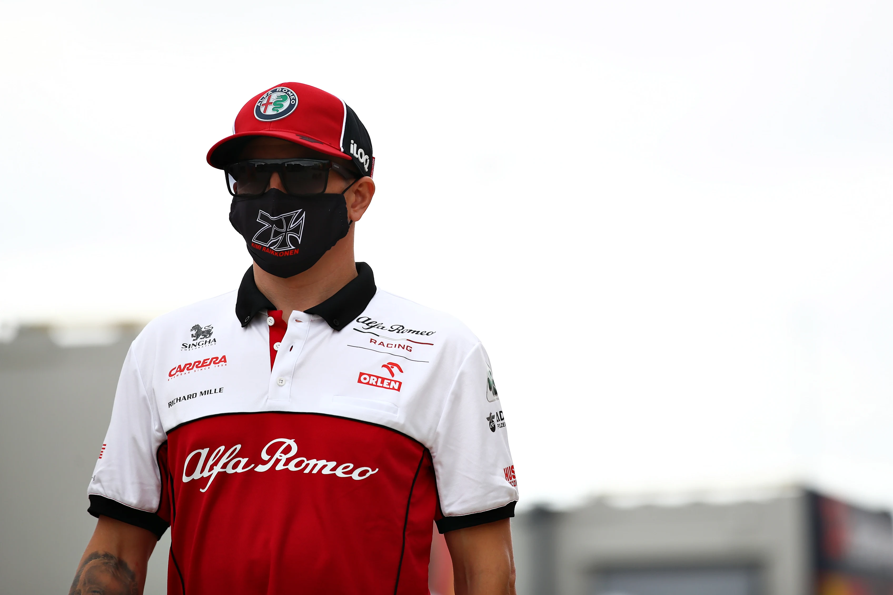 NORTHAMPTON, ENGLAND - AUGUST 06: Kimi Raikkonen of Finland and Alfa Romeo Racing walks in the
