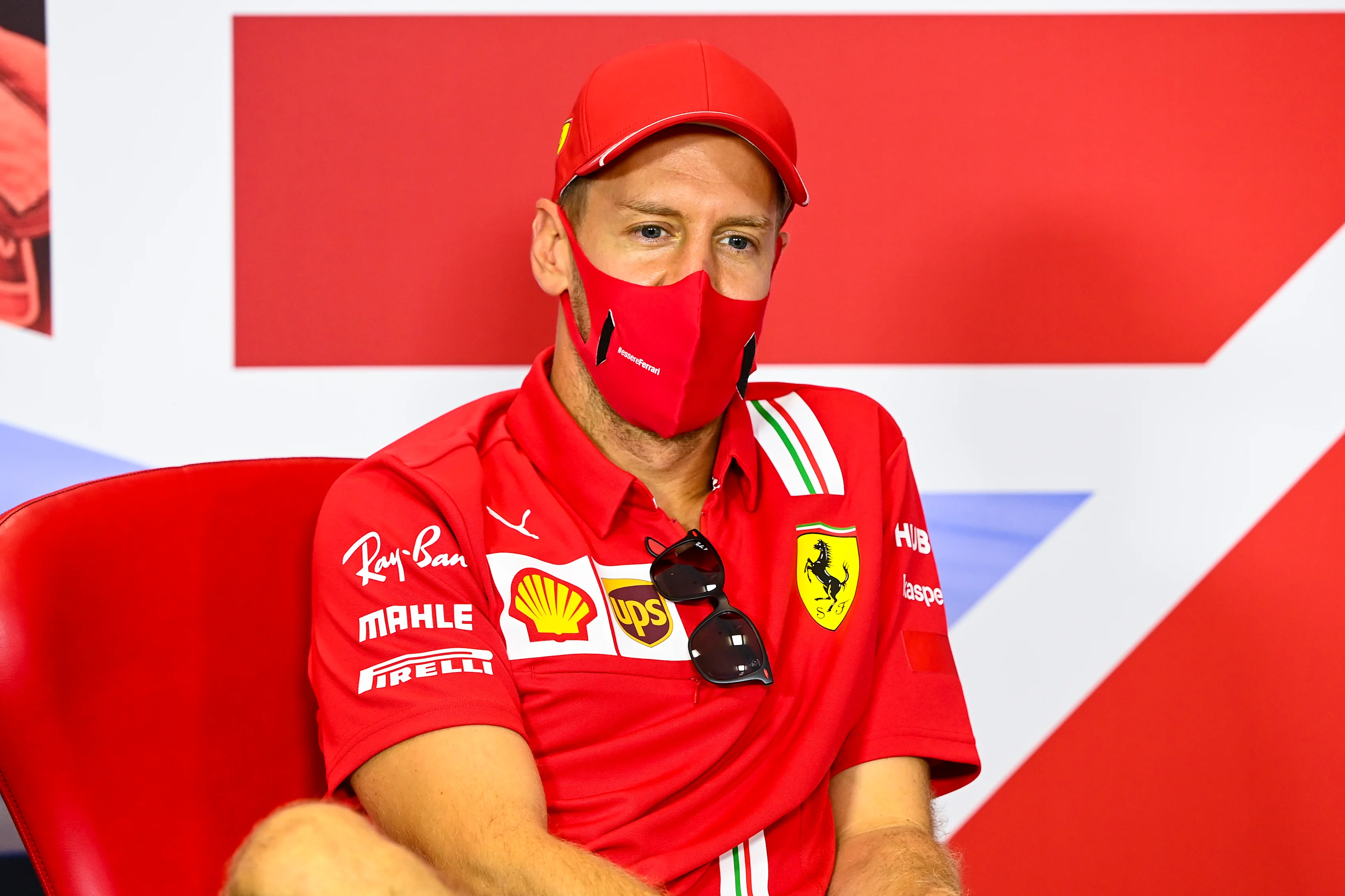 NORTHAMPTON, ENGLAND - AUGUST 06: Sebastian Vettel of Germany and Ferrari talks in the drivers