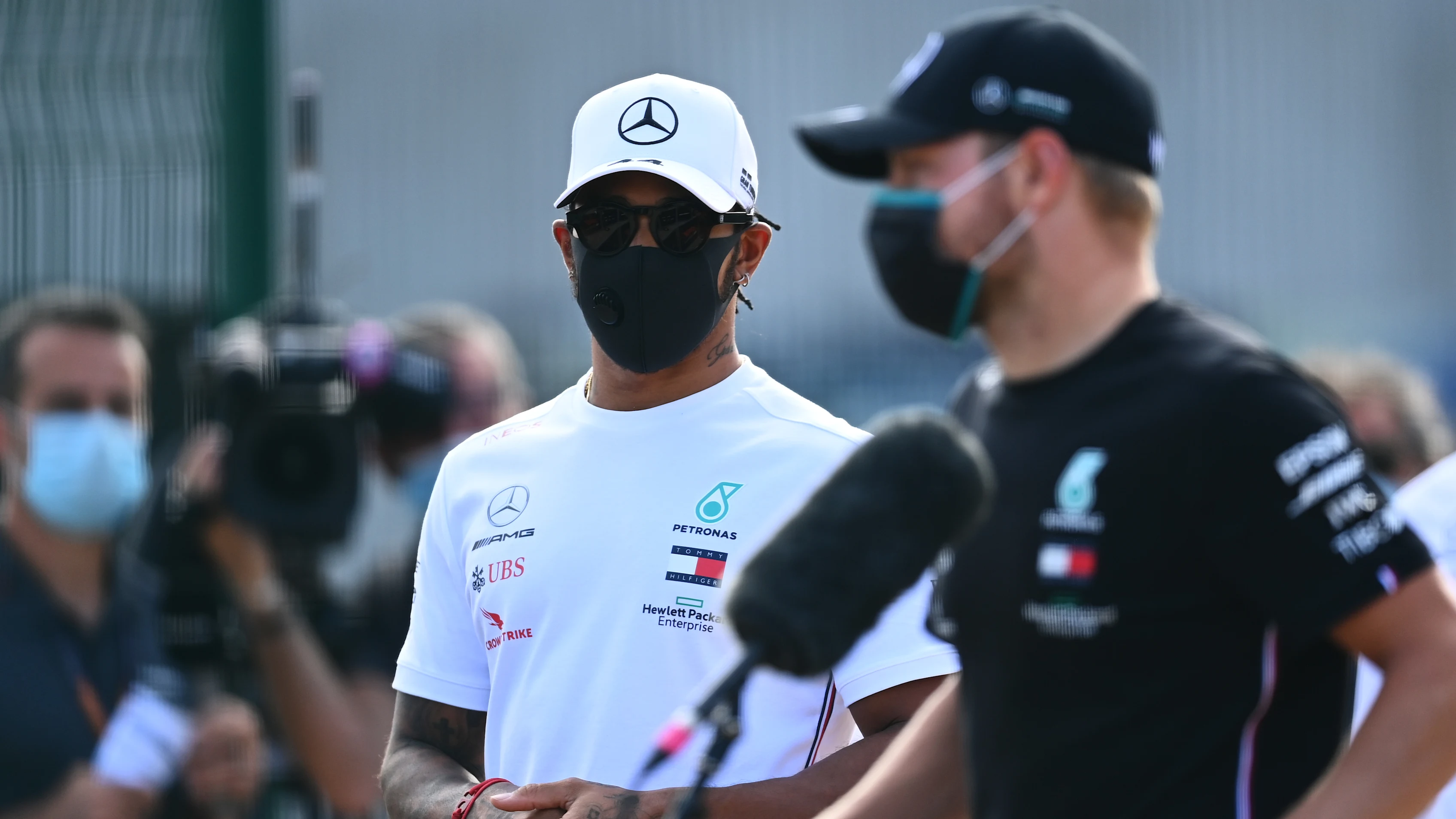 NORTHAMPTON, ENGLAND - AUGUST 06: Lewis Hamilton of Great Britain and Mercedes GP looks on as