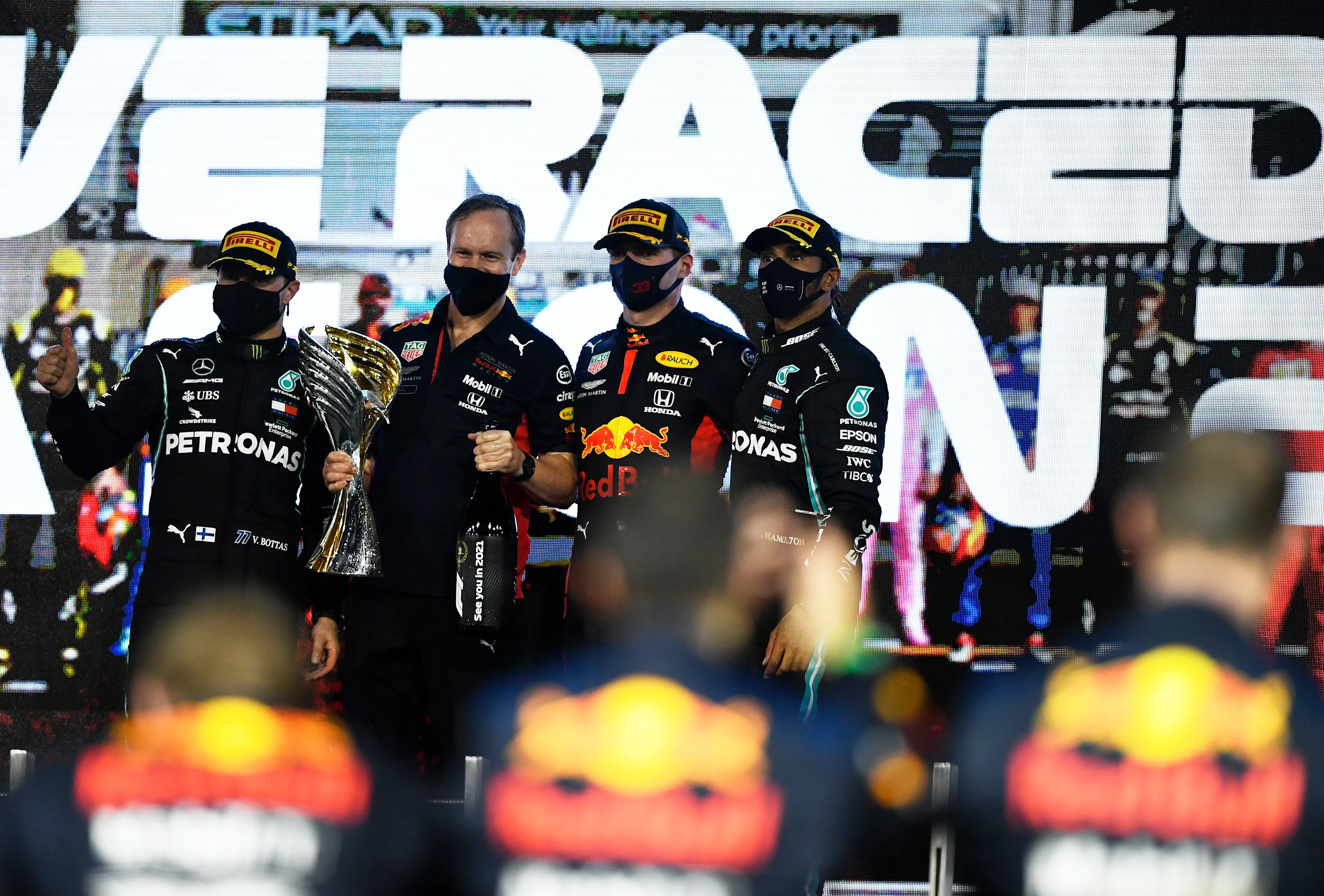 ABU DHABI, UNITED ARAB EMIRATES - DECEMBER 13: Race winner Max Verstappen of Netherlands and Red