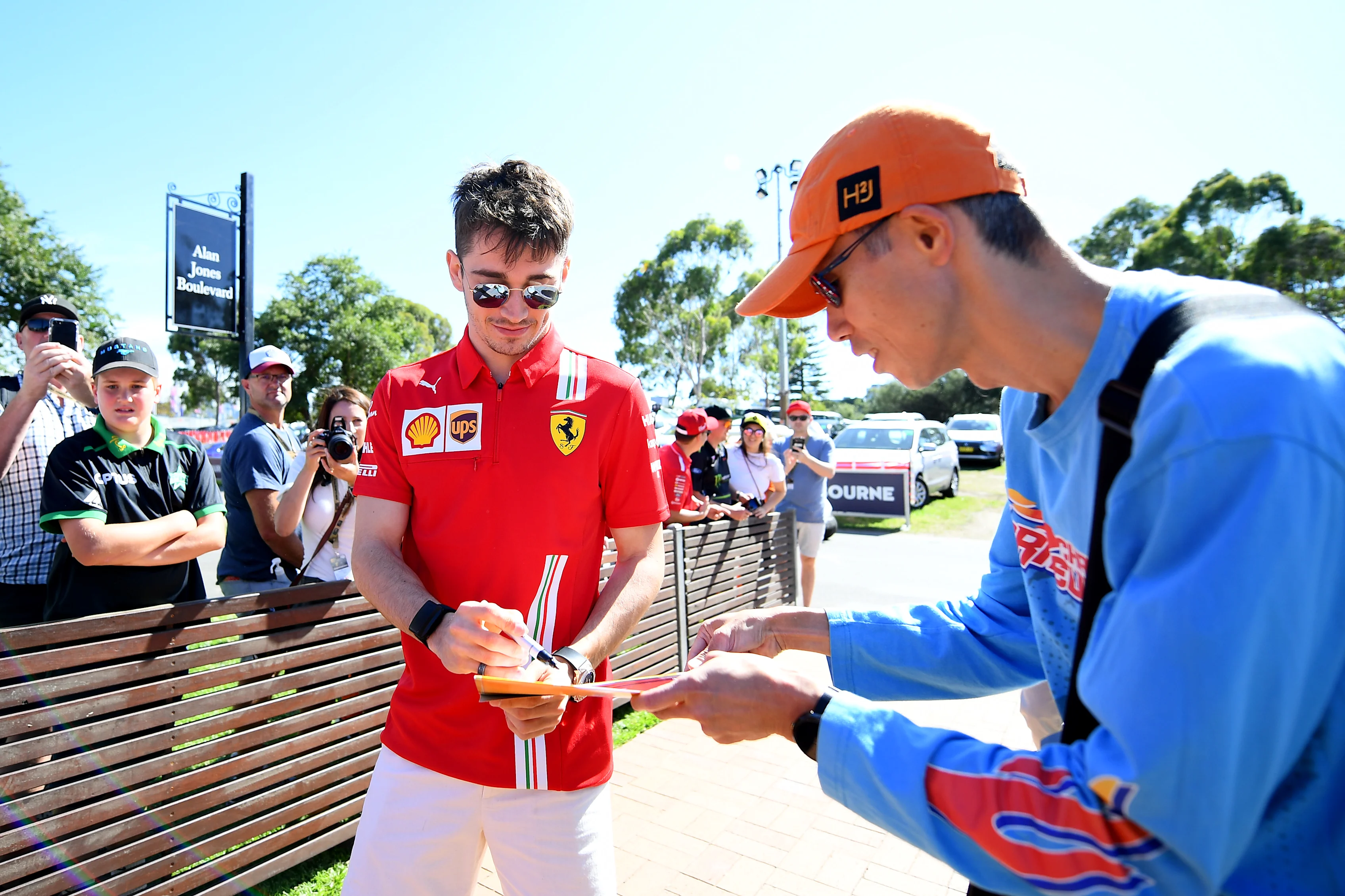 MELBOURNE, AUSTRALIA - MARCH 12: Charles Leclerc of Monaco and Ferrari signs autographs as he