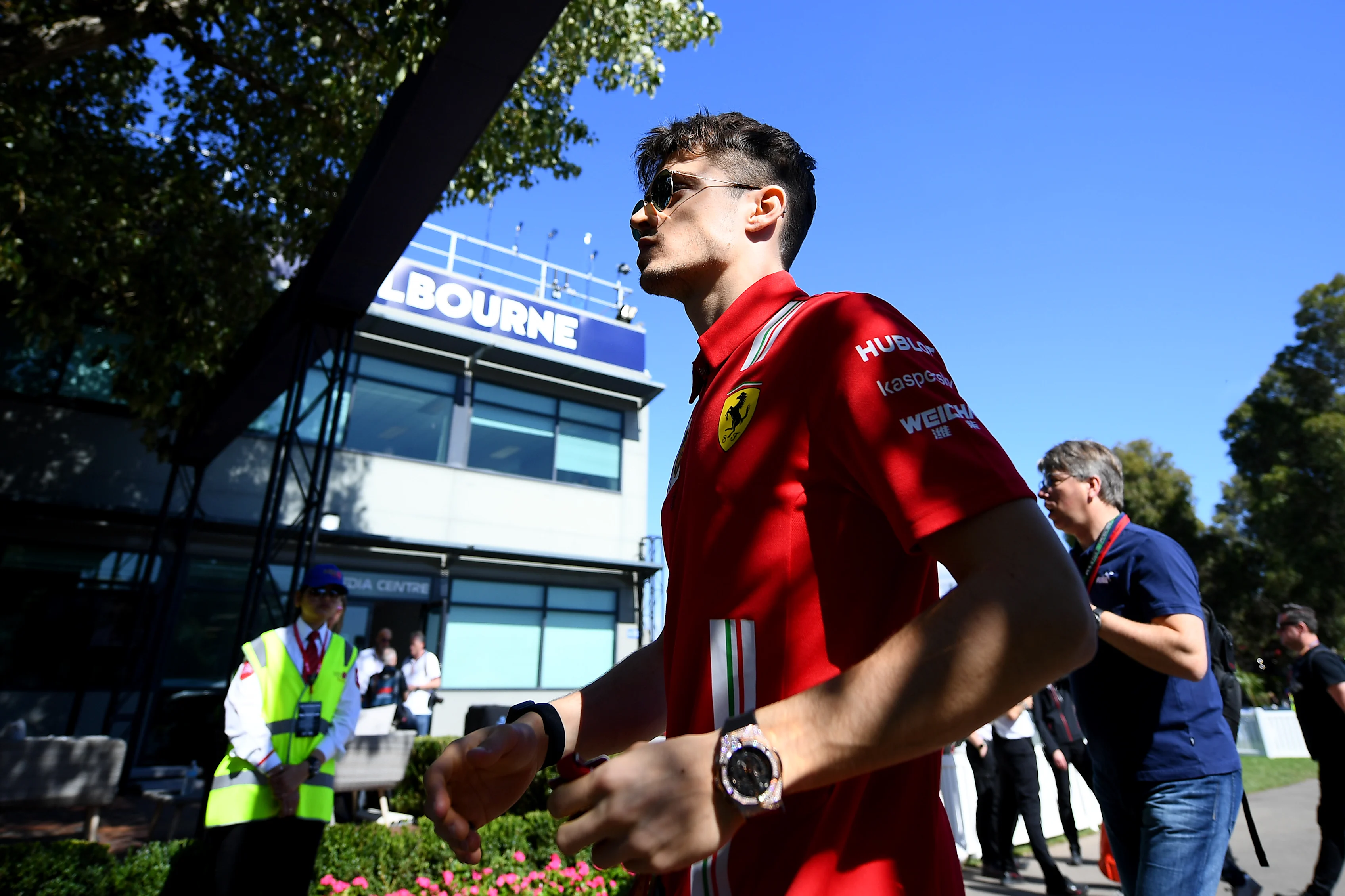 MELBOURNE, AUSTRALIA - MARCH 12: Charles Leclerc of Monaco and Ferrari walks in the Paddock during