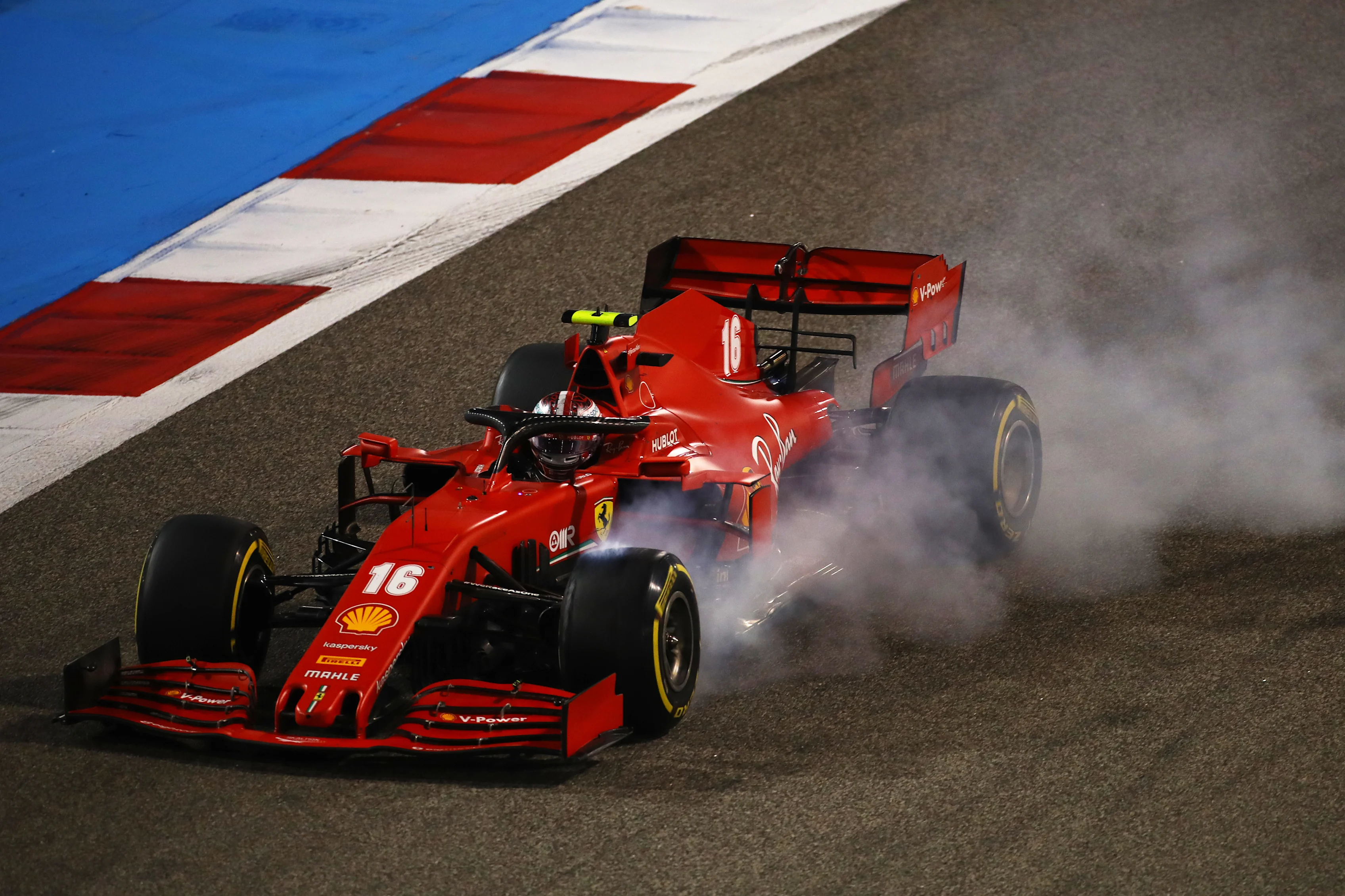 BAHRAIN, BAHRAIN - NOVEMBER 29: Charles Leclerc of Monaco driving the (16) Scuderia Ferrari SF1000 locks up during the F1 Grand Prix of Bahrain at Bahrain International Circuit on November 29, 2020 in Bahrain, Bahrain. (Photo by Bryn Lennon/Getty Images)