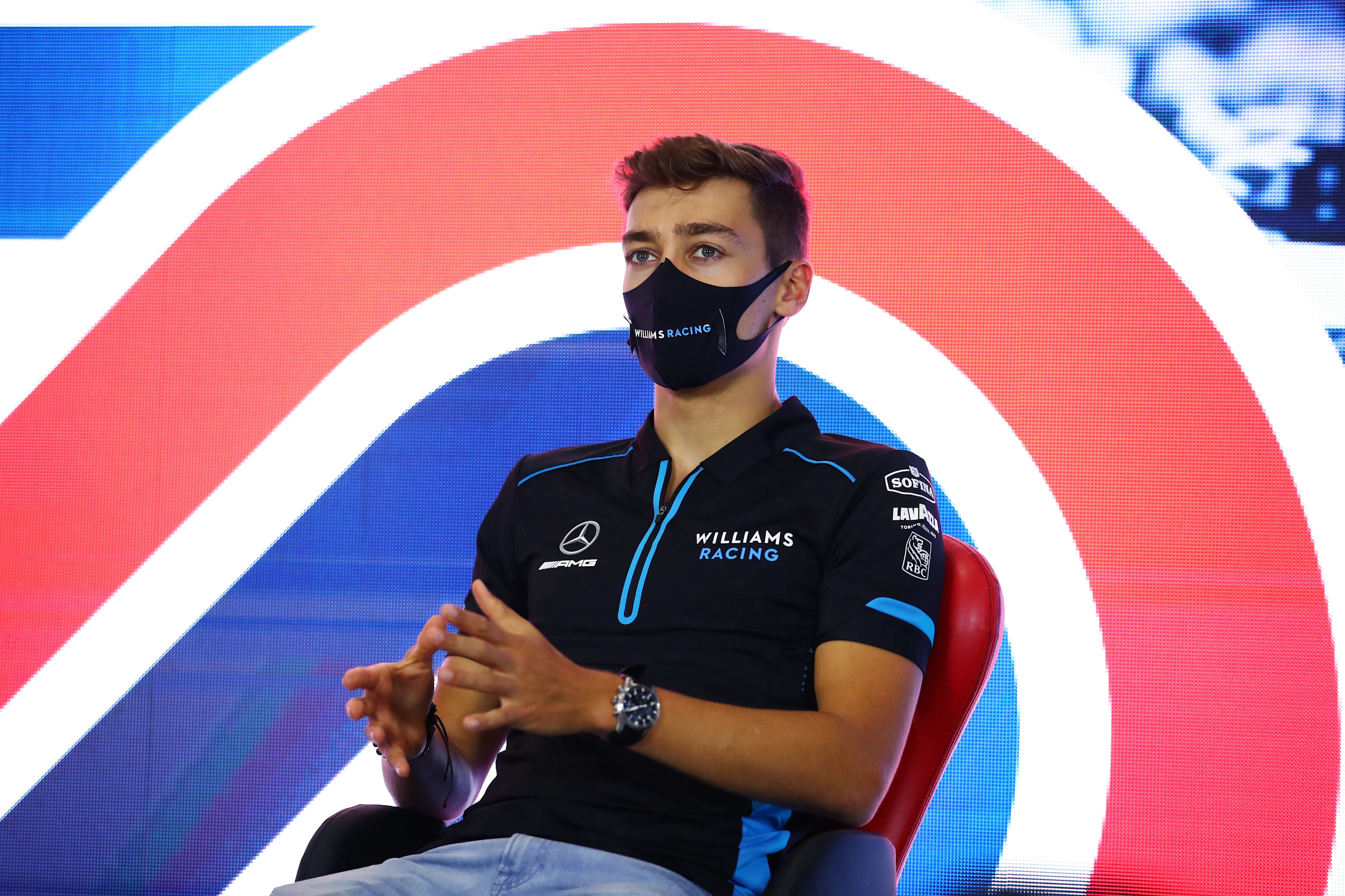 NORTHAMPTON, ENGLAND - JULY 30: George Russell of Great Britain and Williams talks in the Drivers