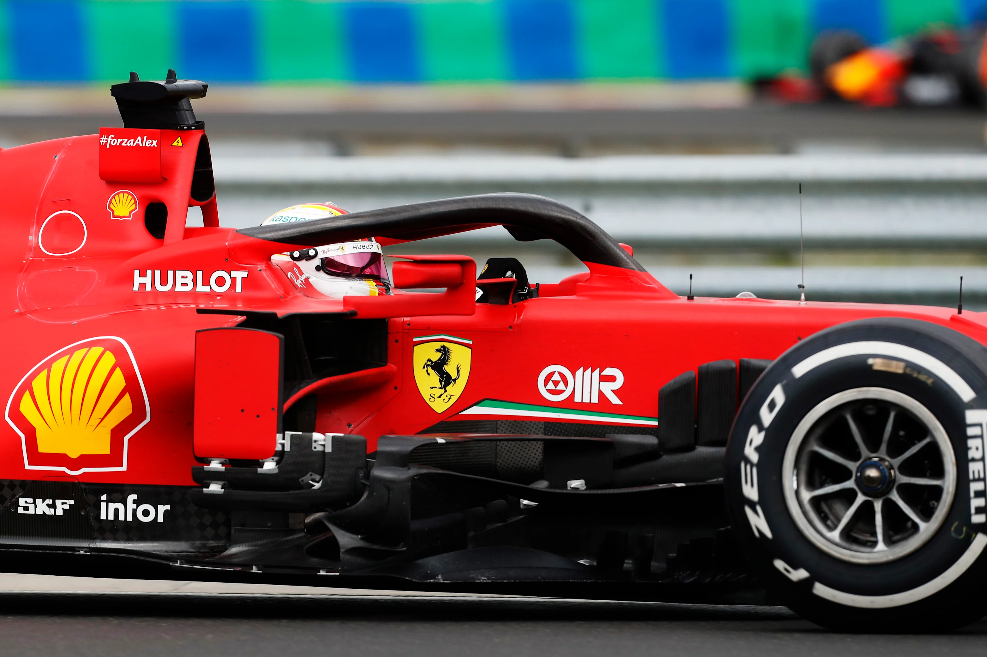 BUDAPEST, HUNGARY - JULY 19: Sebastian Vettel of Germany driving the (5) Scuderia Ferrari SF1000 on