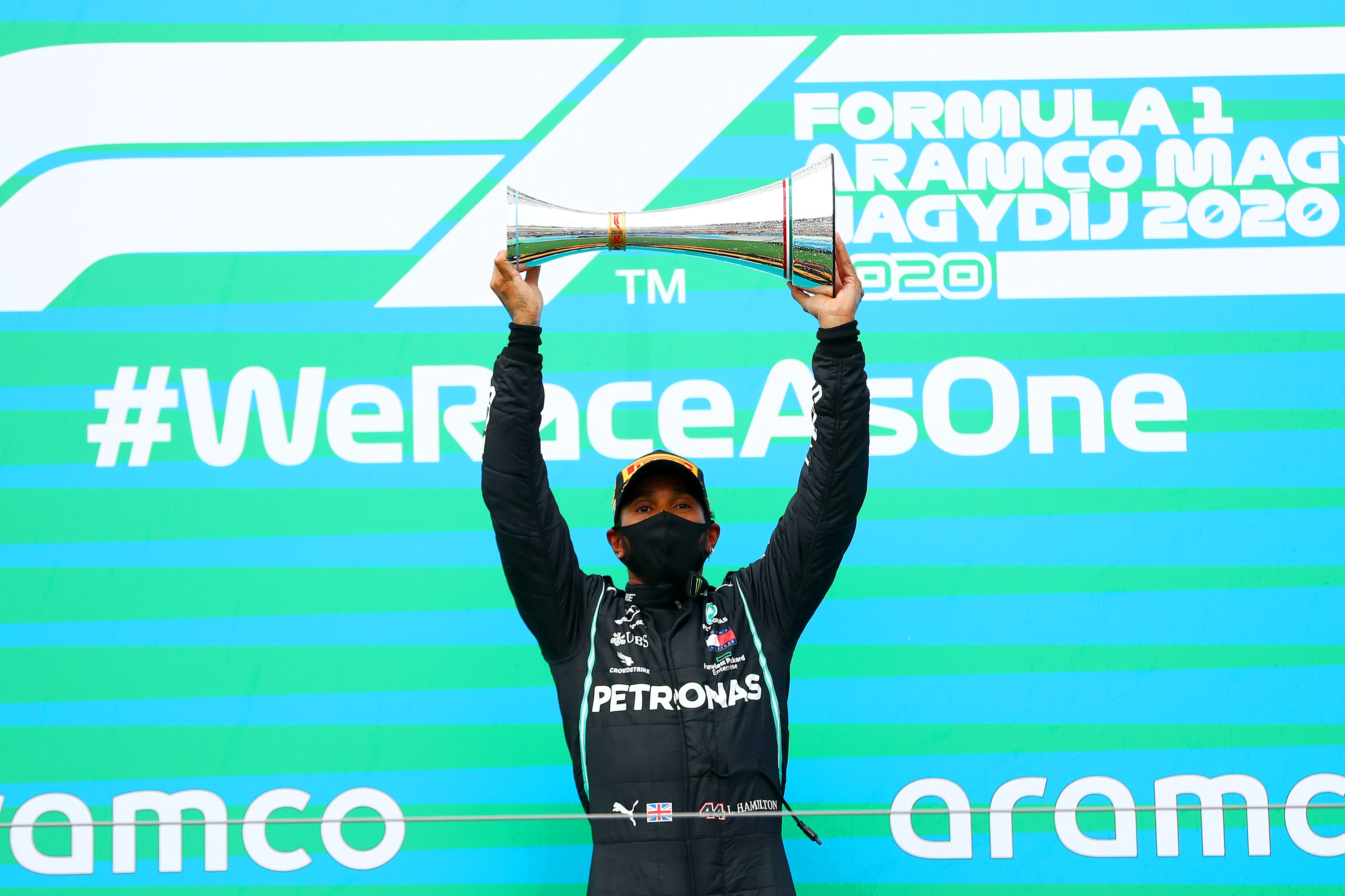 BUDAPEST, HUNGARY - JULY 19: Lewis Hamilton of Great Britain and Mercedes GP lifts the trophy on
