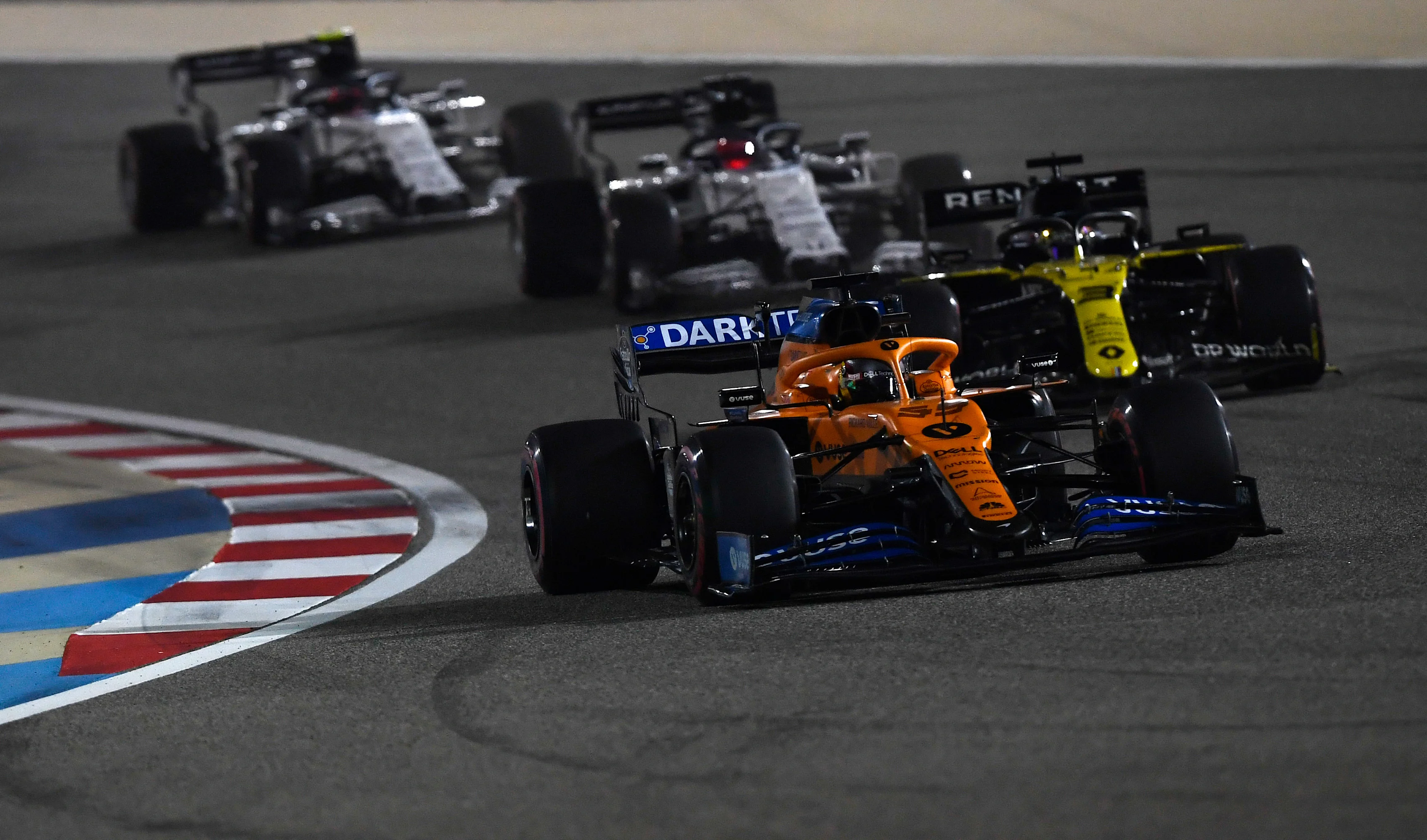 BAHRAIN, BAHRAIN - DECEMBER 06: Carlos Sainz of Spain driving the (55) McLaren F1 Team MCL35 Renault leads Daniel Ricciardo of Australia driving the (3) Renault Sport Formula One Team RS20 on track during the F1 Grand Prix of Sakhir at Bahrain International Circuit on December 06, 2020 in Bahrain, Bahrain. (Photo by Rudy Carezzevoli/Getty Images)