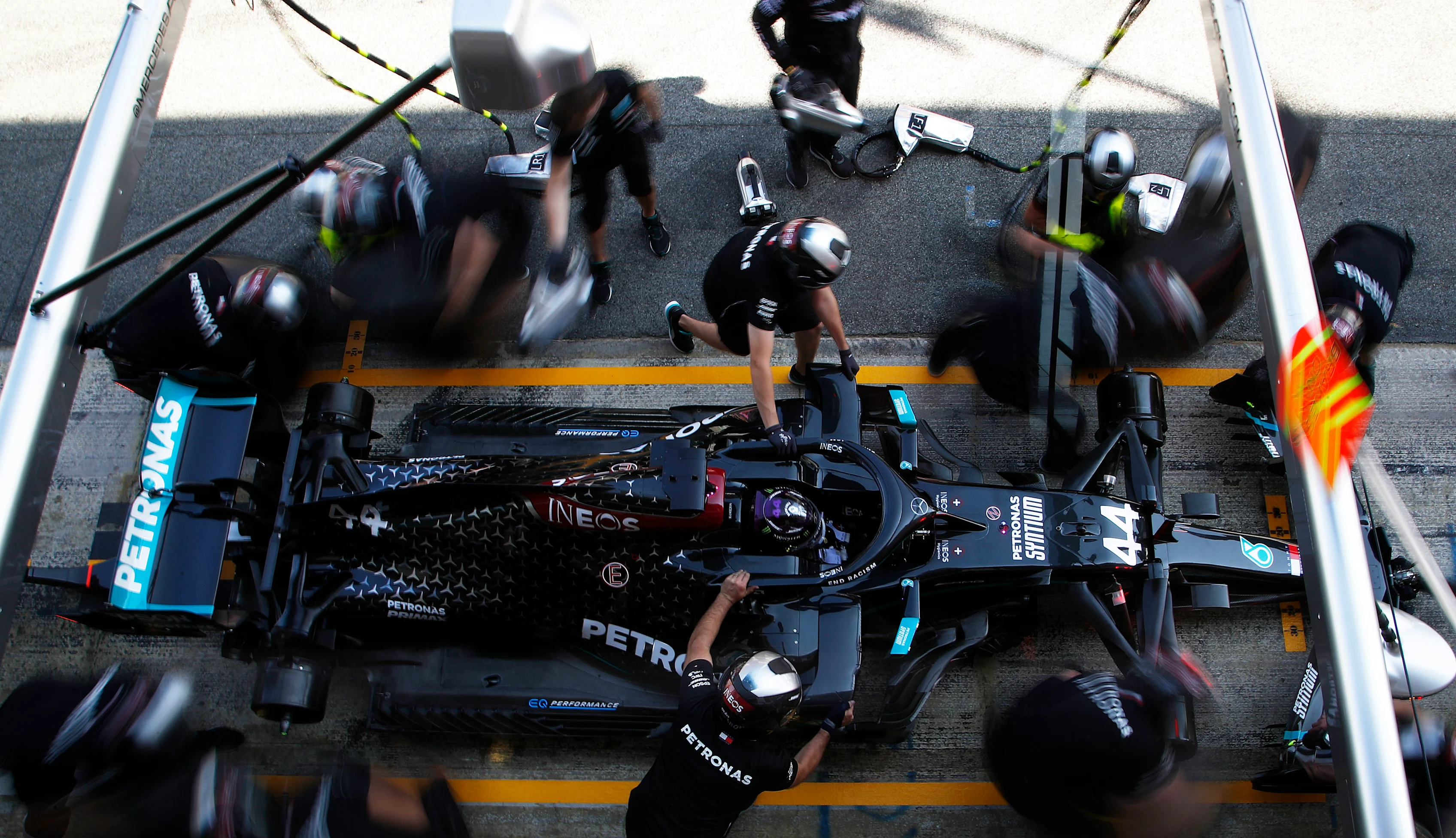BARCELONA, SPAIN - AUGUST 14: Lewis Hamilton of Great Britain driving the (44) Mercedes AMG Petronas F1 Team Mercedes W11 stops in the Pitlane during practice for the F1 Grand Prix of Spain at Circuit de Barcelona-Catalunya on August 14, 2020 in Barcelona, Spain. (Photo by Emiliano Morenatti/Pool via Getty Images)