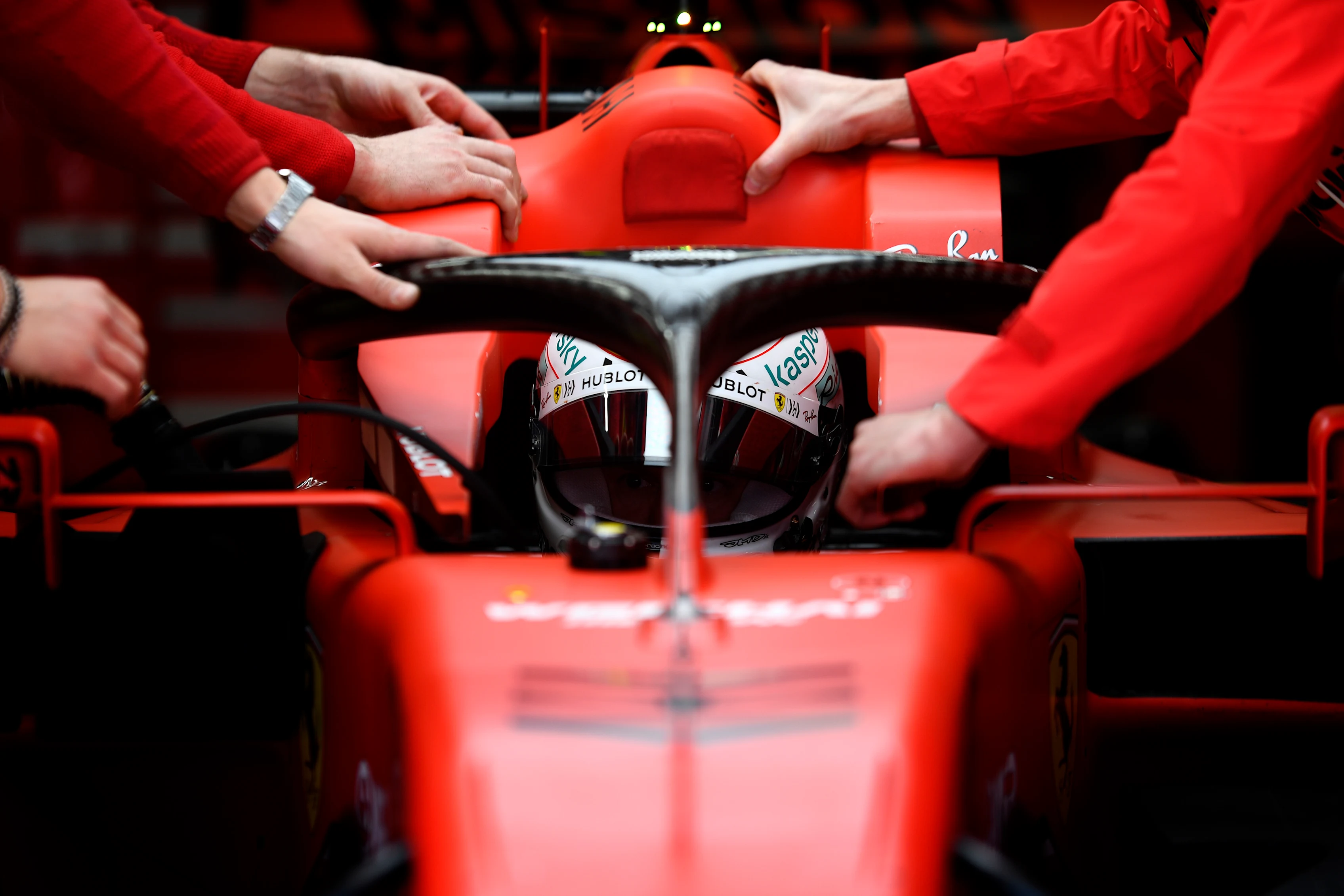 BARCELONA, SPAIN - FEBRUARY 27: Sebastian Vettel of Germany and Ferrari prepares to drive in the