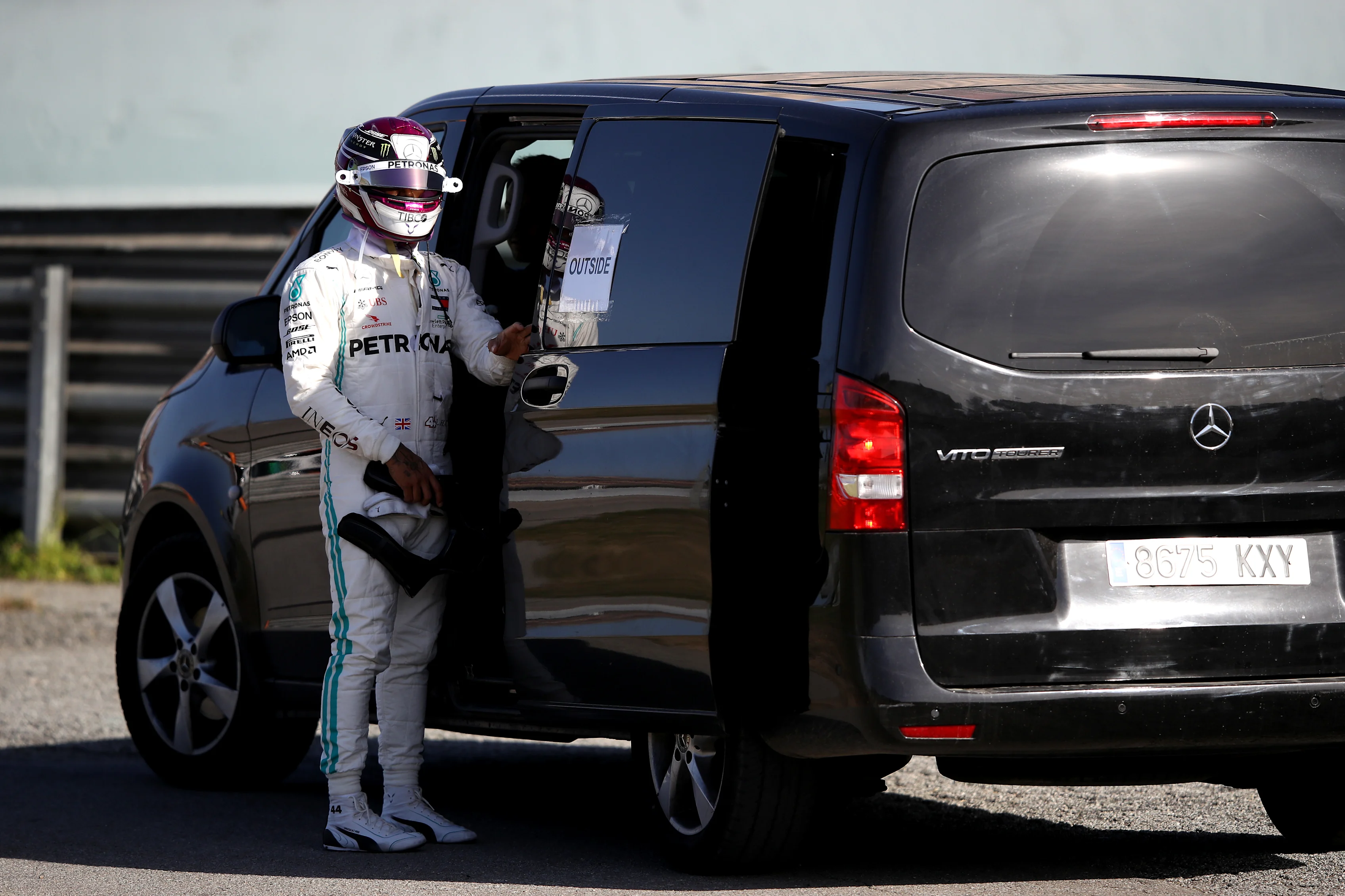 BARCELONA, SPAIN - FEBRUARY 27: Lewis Hamilton of Great Britain and Mercedes GP gets into a