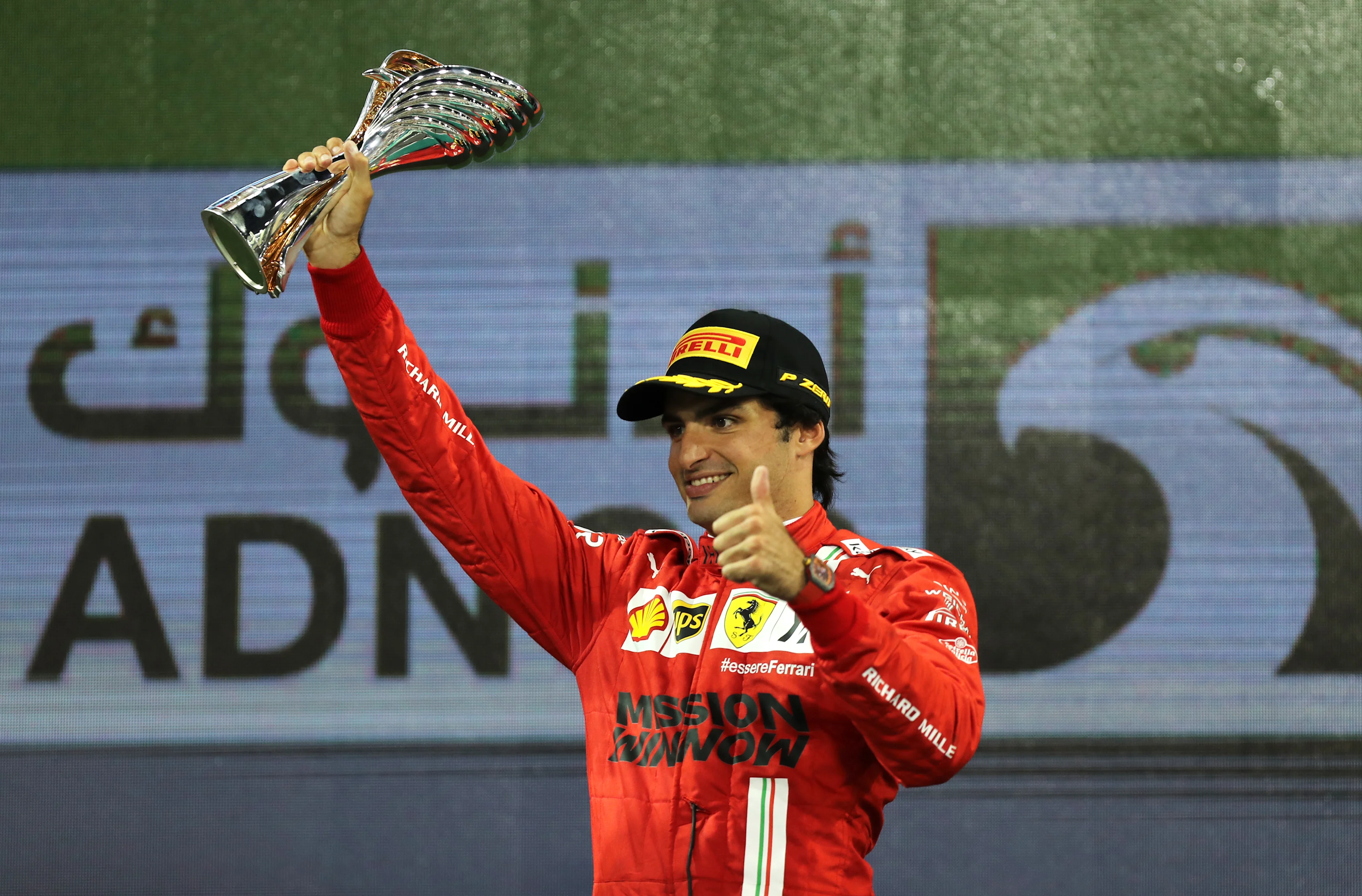 ABU DHABI, UNITED ARAB EMIRATES - DECEMBER 12: Third placed Carlos Sainz of Spain and Ferrari