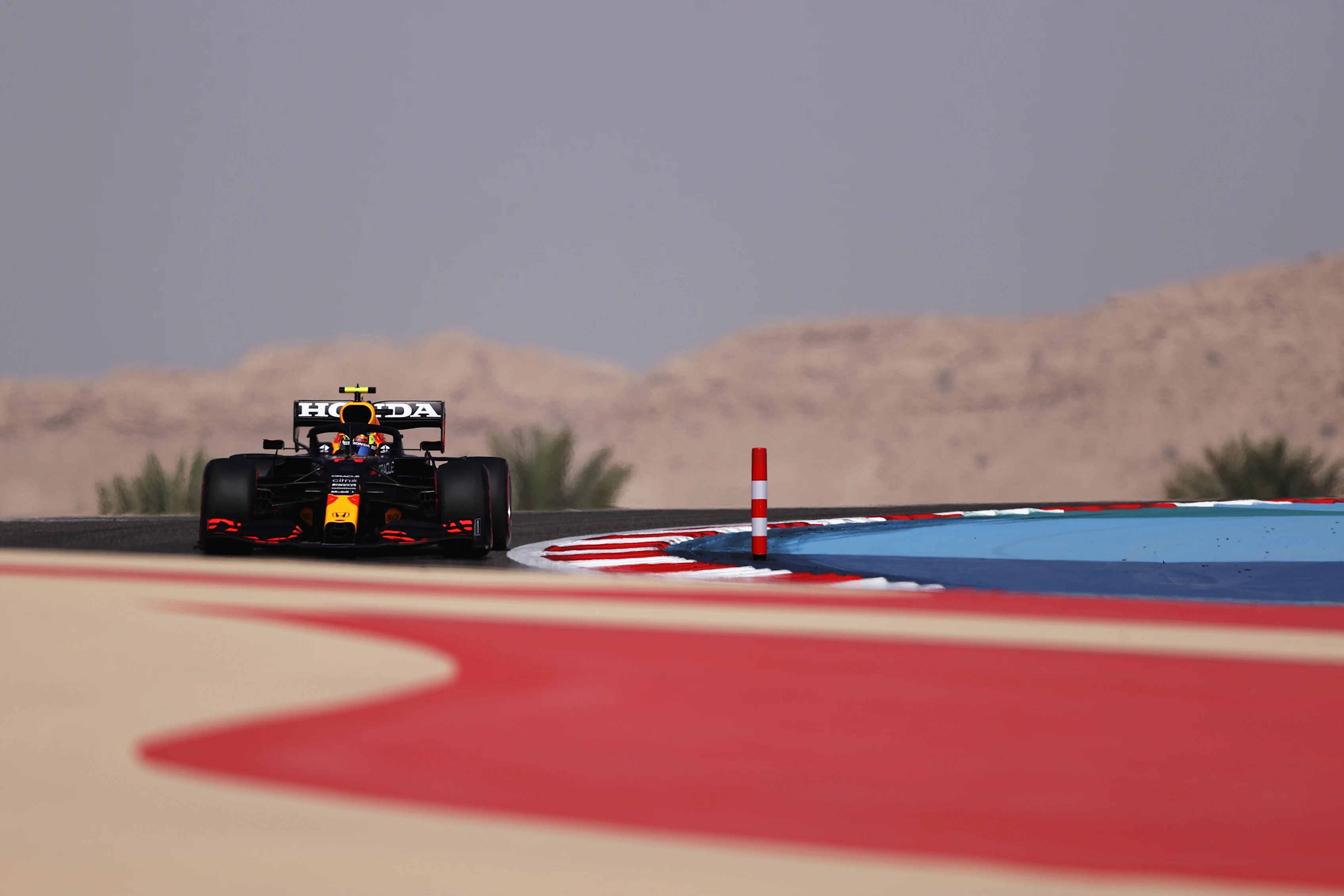 BAHRAIN, BAHRAIN - MARCH 26: Sergio Perez of Mexico driving the (11) Red Bull Racing RB16B Honda on track during practice ahead of the F1 Grand Prix of Bahrain at Bahrain International Circuit on March 26, 2021 in Bahrain, Bahrain. (Photo by Lars Baron/Getty Images)