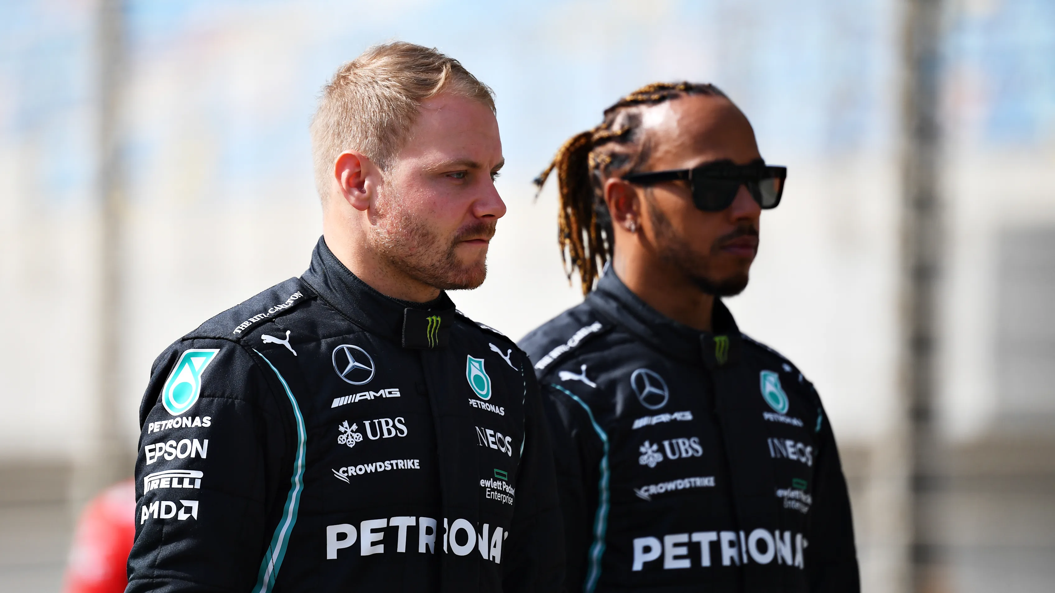 BAHRAIN, BAHRAIN - MARCH 12: Valtteri Bottas of Finland and Mercedes GP and Lewis Hamilton of Great