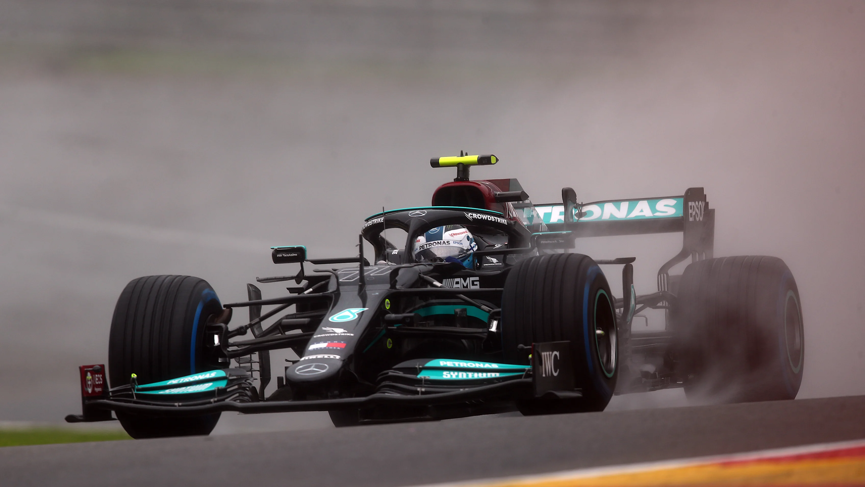SPA, BELGIUM - AUGUST 29: Valtteri Bottas of Finland driving the (77) Mercedes AMG Petronas F1 Team Mercedes W12 on the way to the grid prior to the F1 Grand Prix of Belgium at Circuit de Spa-Francorchamps on August 29, 2021 in Spa, Belgium. (Photo by Joe Portlock - Formula 1/Formula 1 via Getty Images)